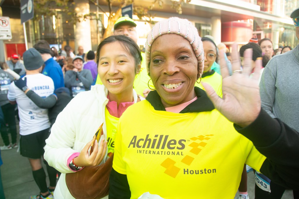  Achilles athlete and guide smiling and waving  