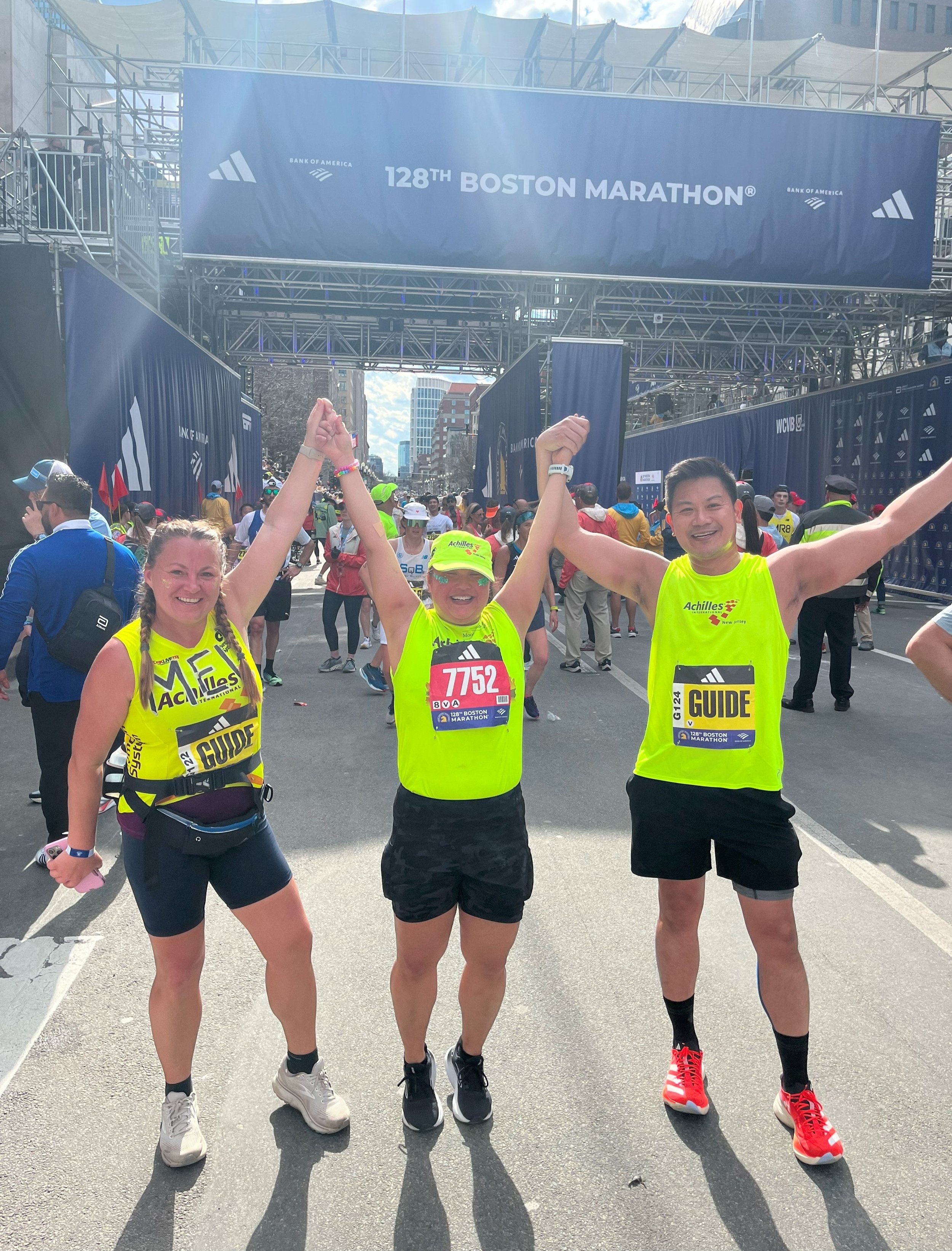  Achilles members cheering at the finish line 