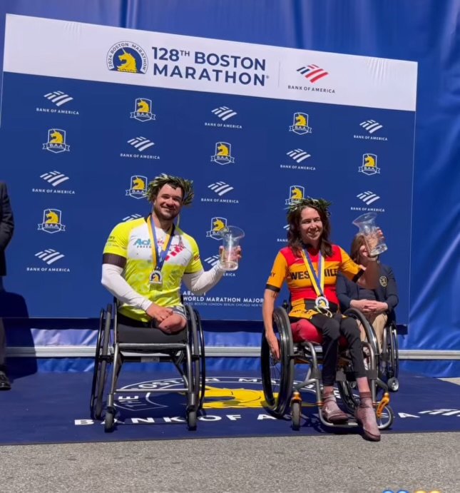  Photo of Zach Stinson being honored at the Boston Marathon after his first place finish in the men’s handcycle division.  