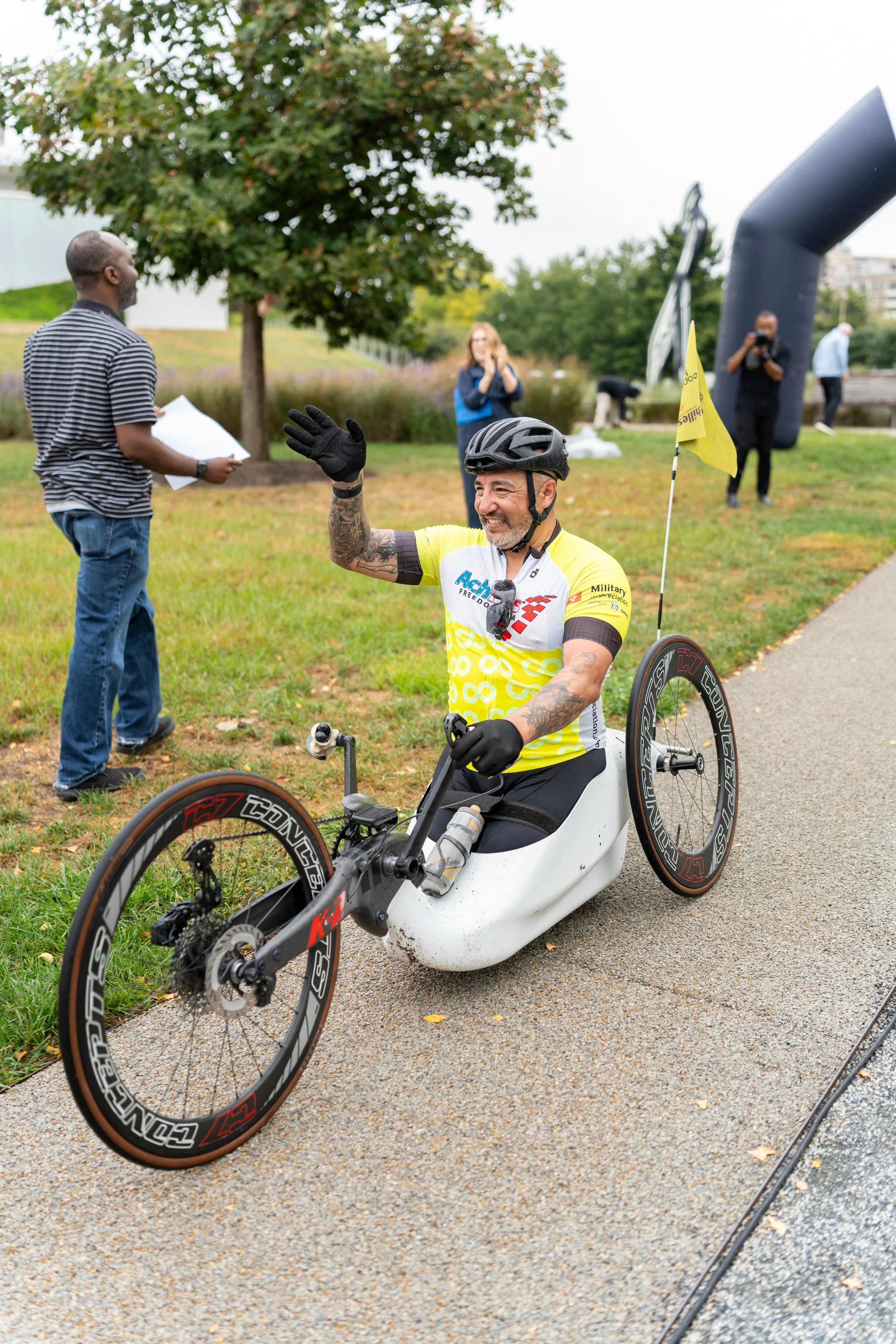 Achilles Freedom Team member smiling on his handcycle