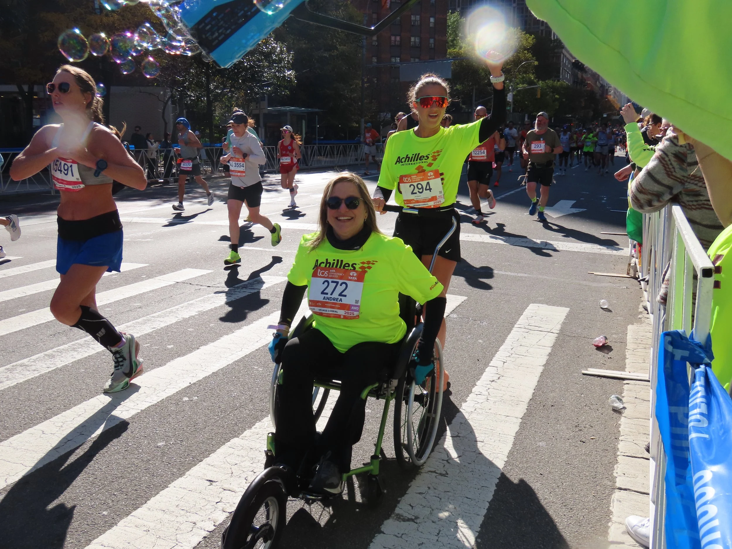  Achilles athlete smiling with her guide on the course.  