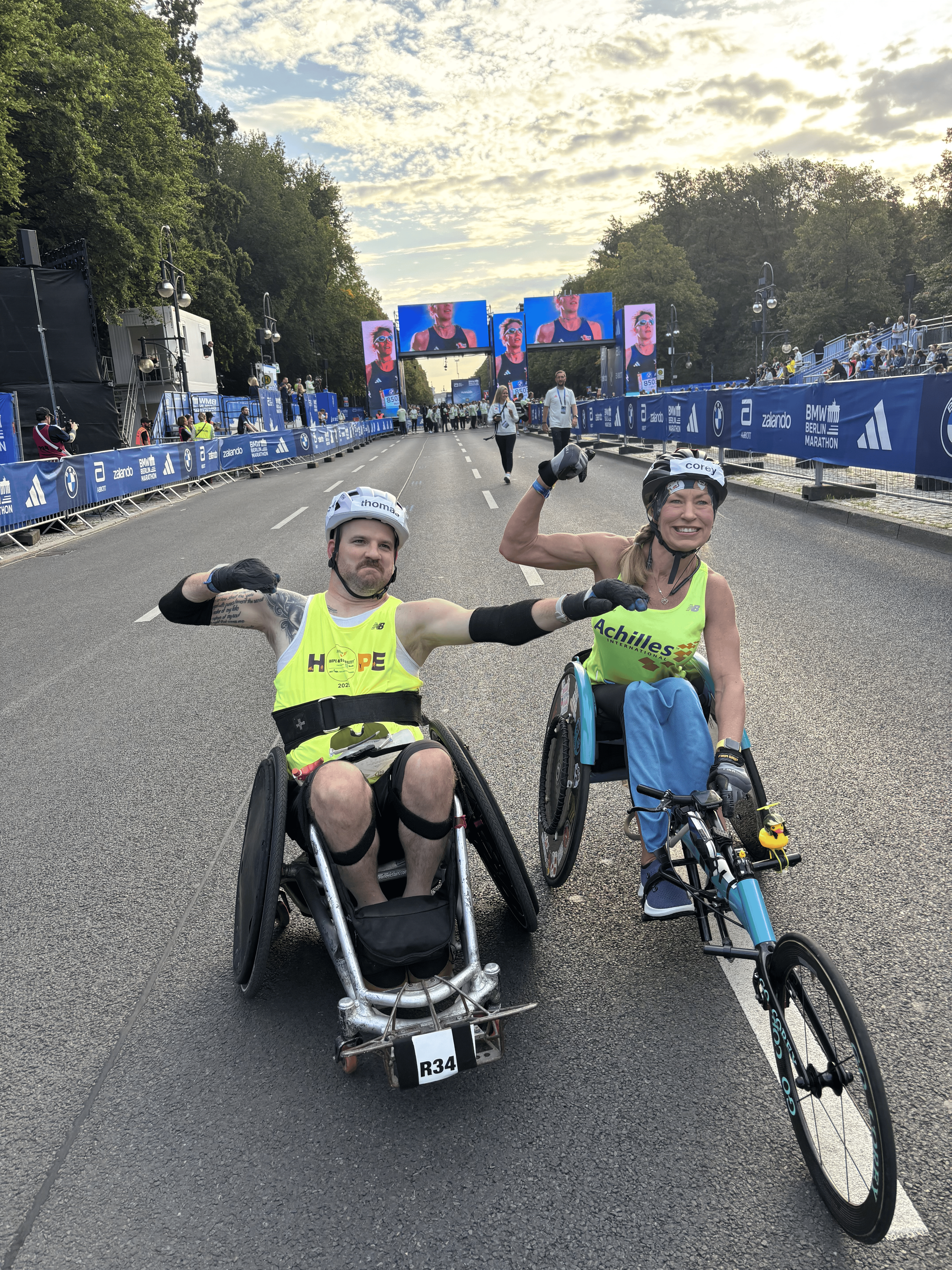  Achilles athletes posing with their muscles flexed.  