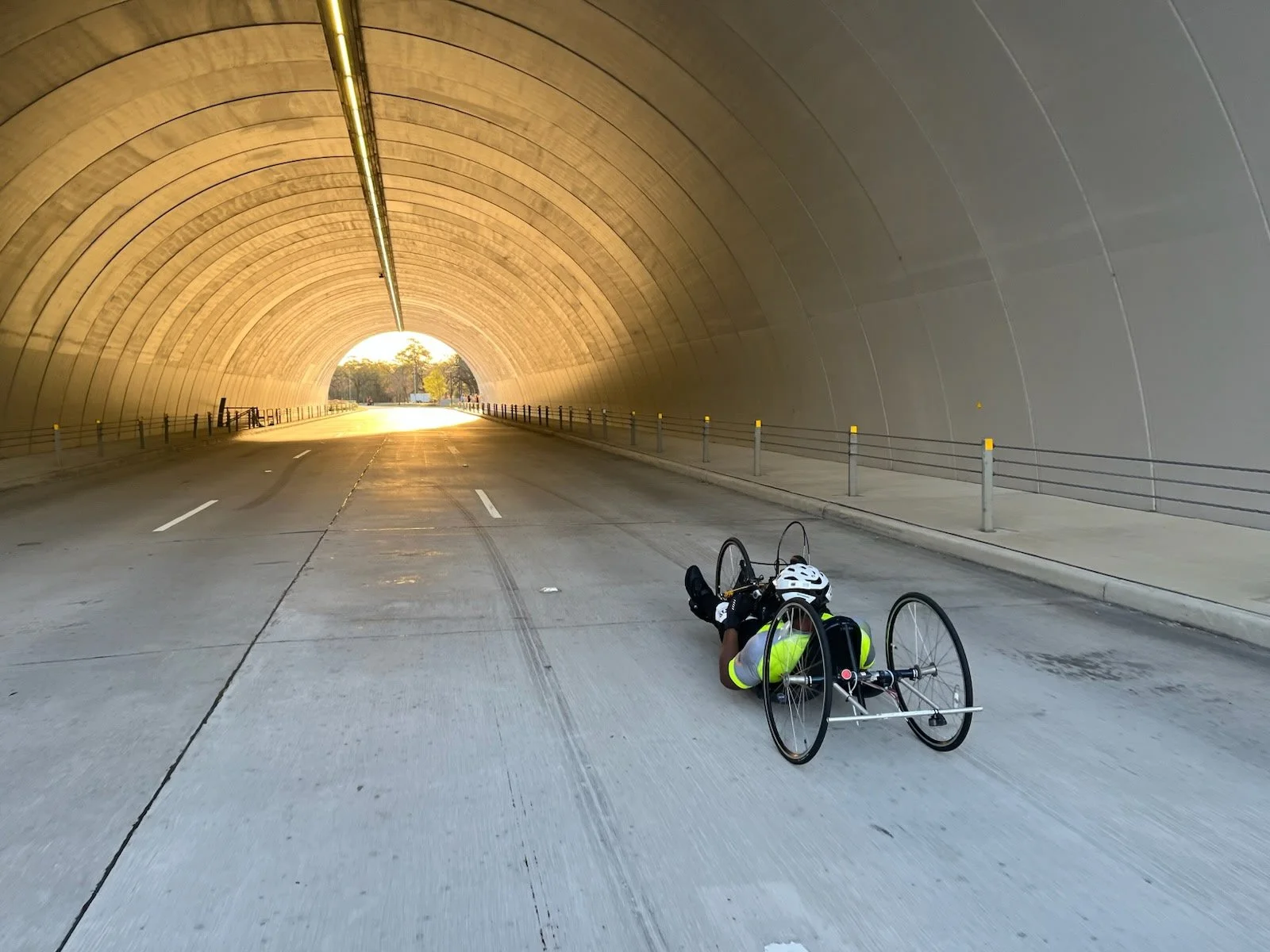  Handcyclist going through a tunnel on the course.  