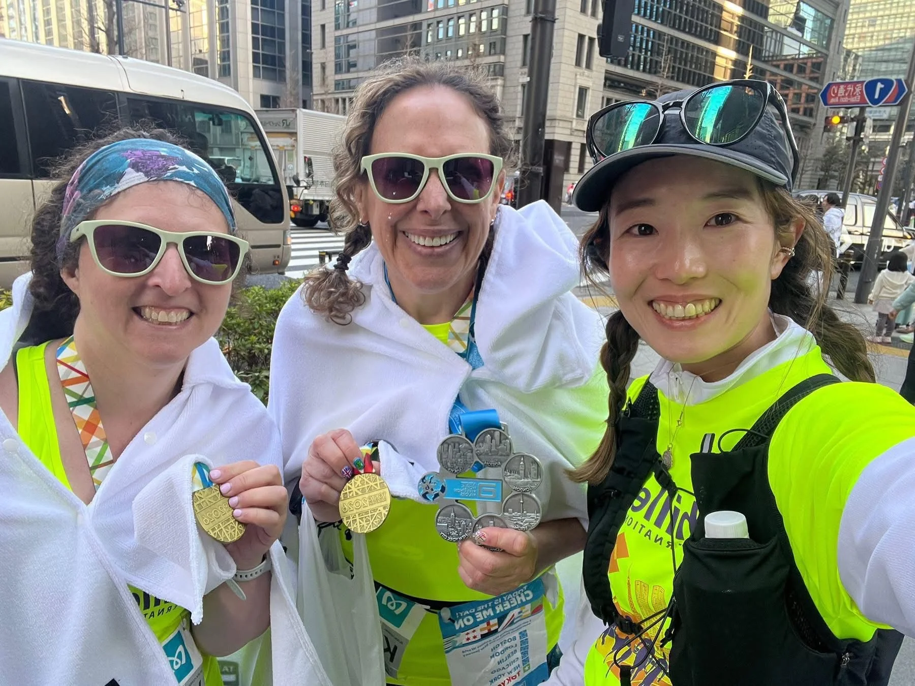  Achilles members posing with their Tokyo Marathon medals.  