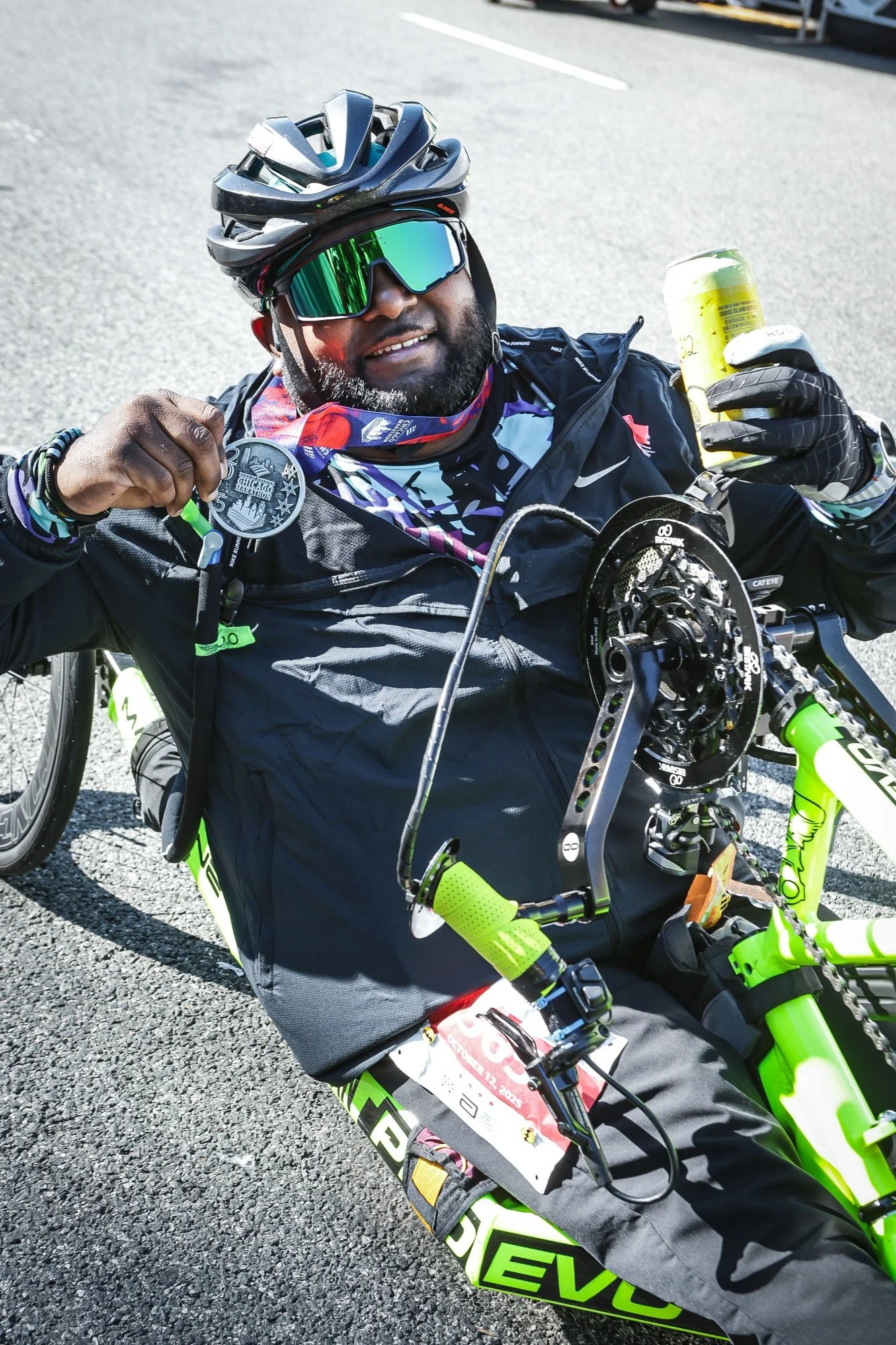  Suraj on his handcycle posing with his Chicago Marathon medal.  