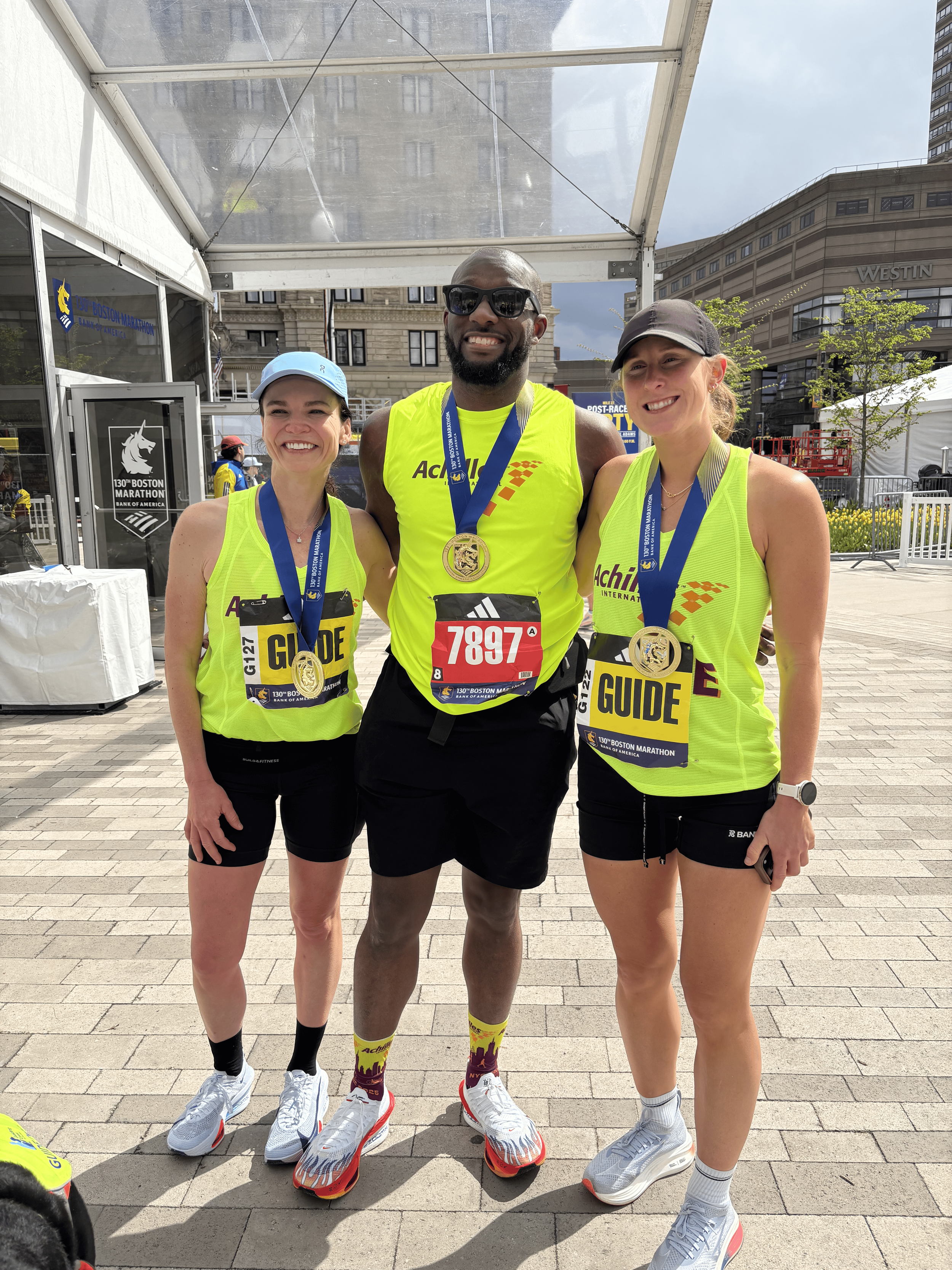  Anthony Butler posing alongside his two guides.  