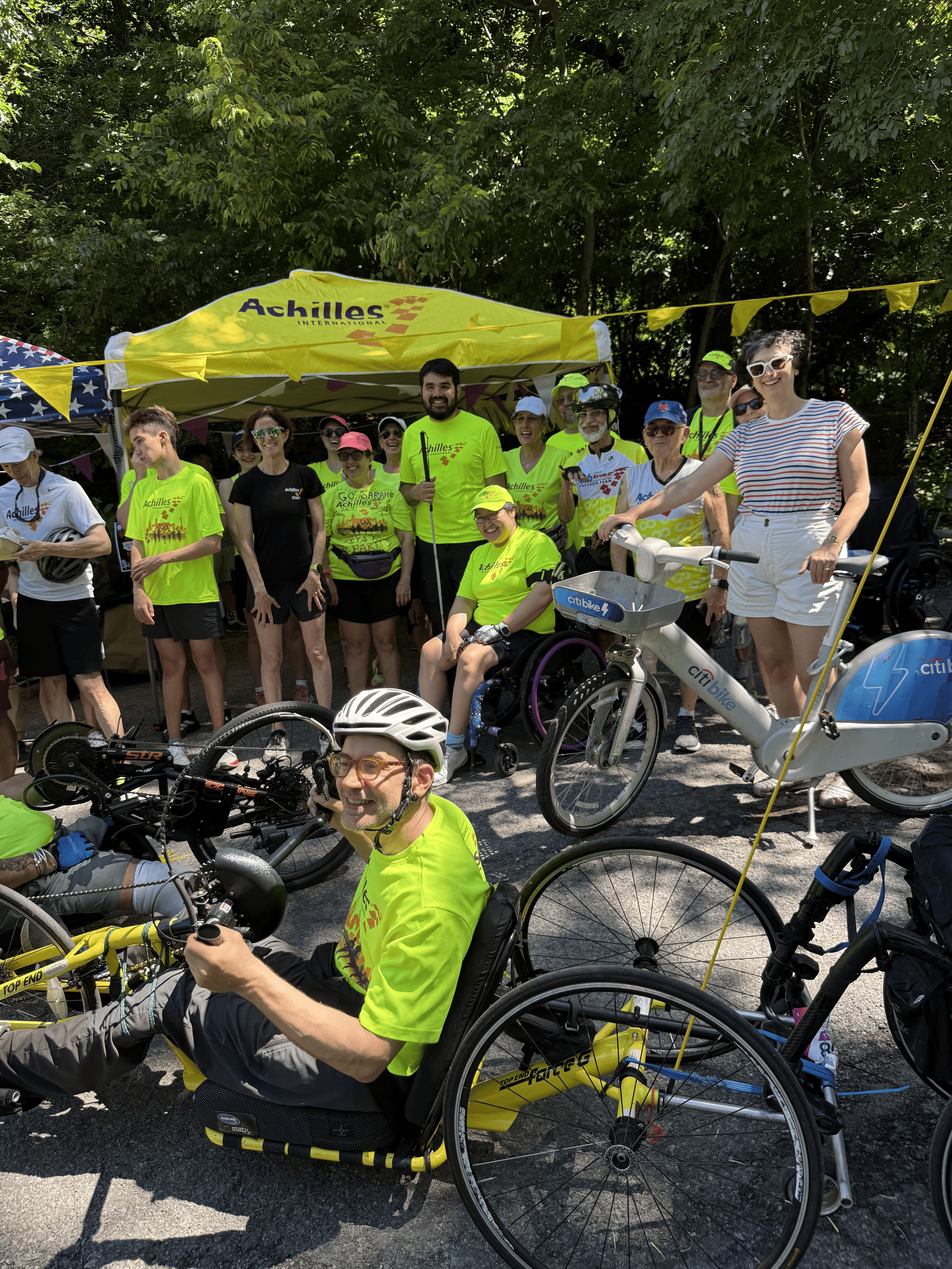  Adaptive athletes posing at the kick off celebration with Achilles and CitiBike leadership.  