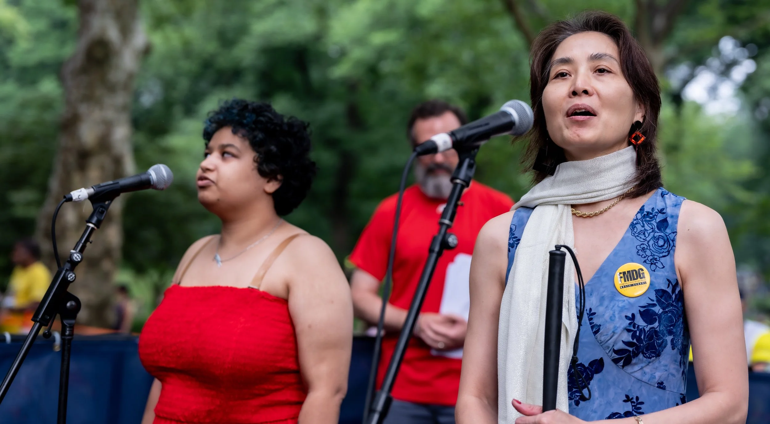  Maya Graves and Mana Hashimoto singing  America the Beautiful .  