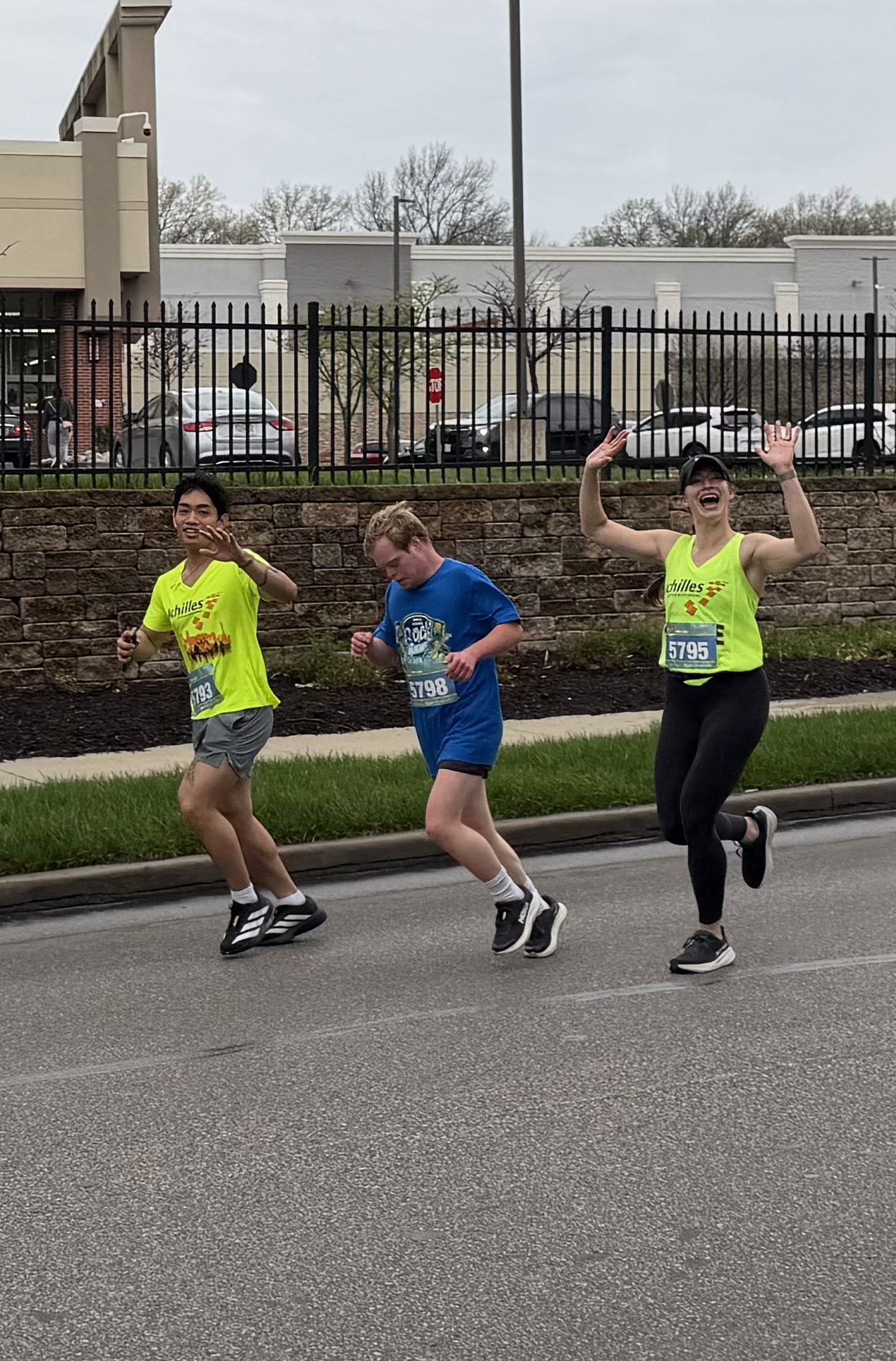  Achilles Kansas City athlete running with their guides.  