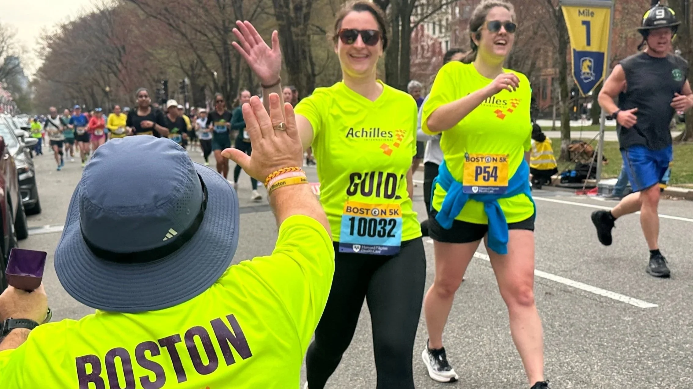 Achilles athlete and guide running together in the Boston Marathon