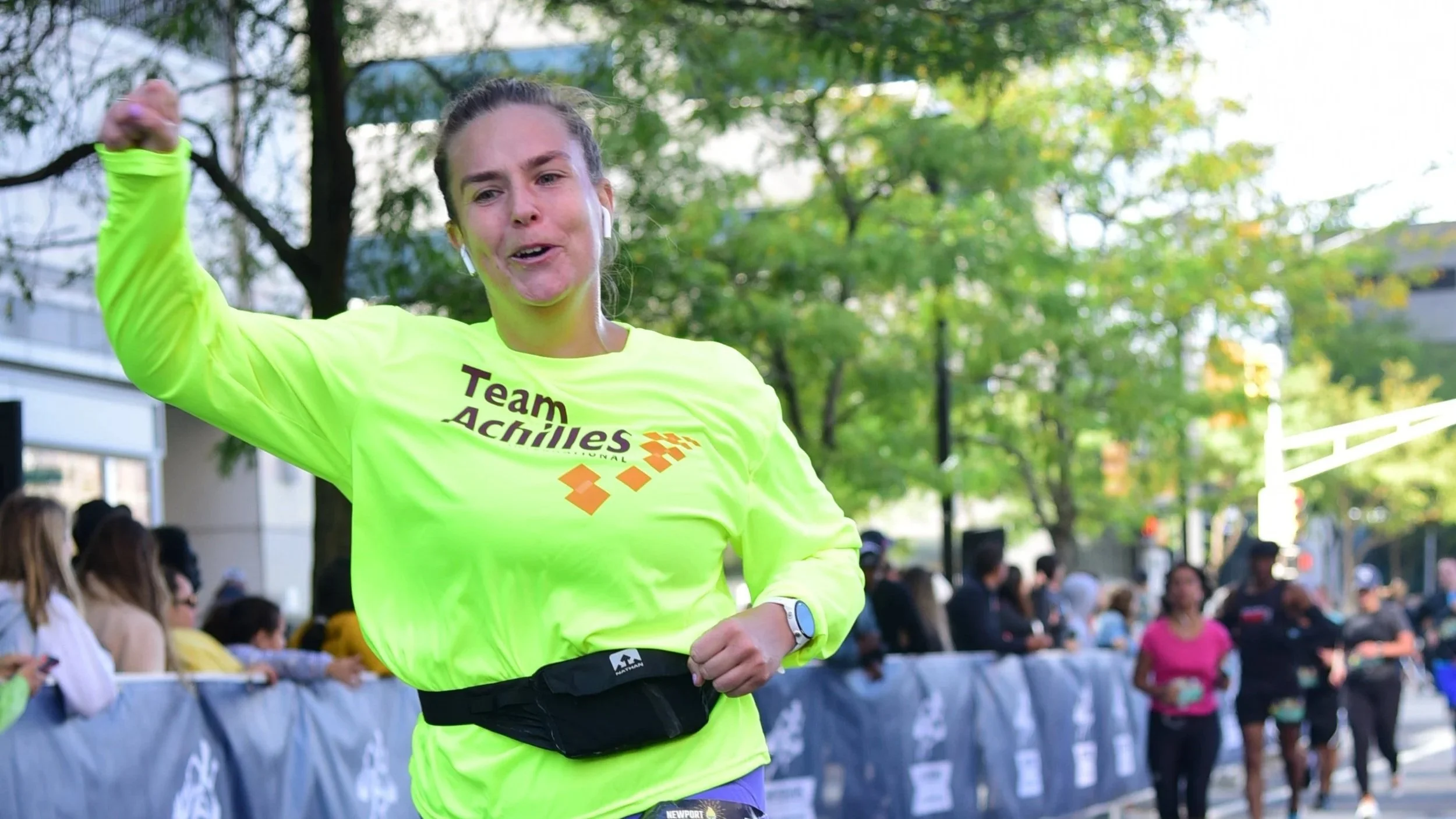 Achilles athletes at the Brandenburg Gate in Berlin with their marathon medals