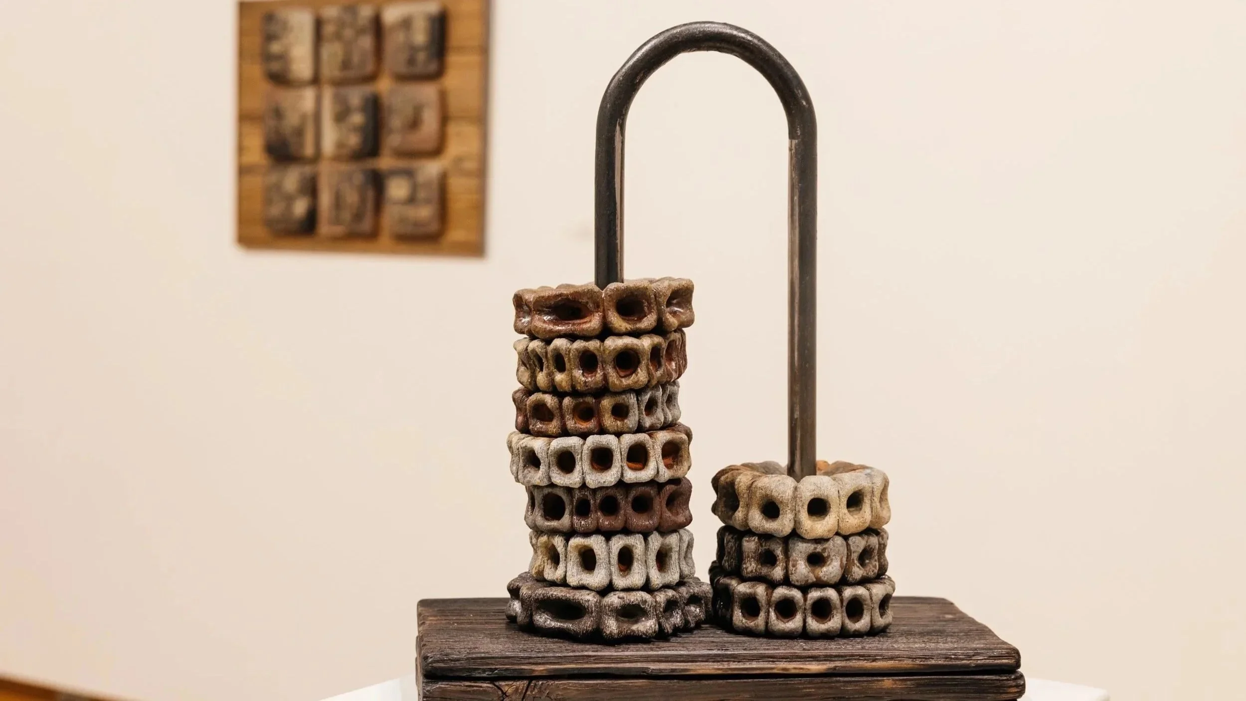 "Over and Over"
Wood fired stoneware threaded along salvaged pulley guide, supported by charred wood base