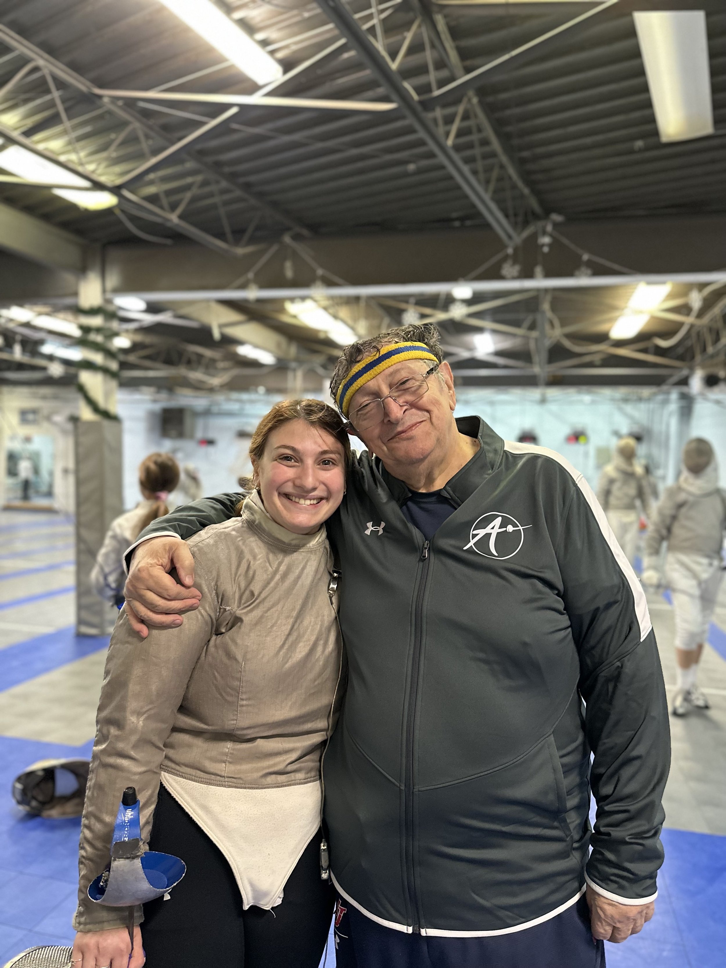 Maestro Misha with alumni and newest coach Ashley Gomerman. Ashley returns to us after a successful career fencing at top Division 1 NCAA school Northwestern University