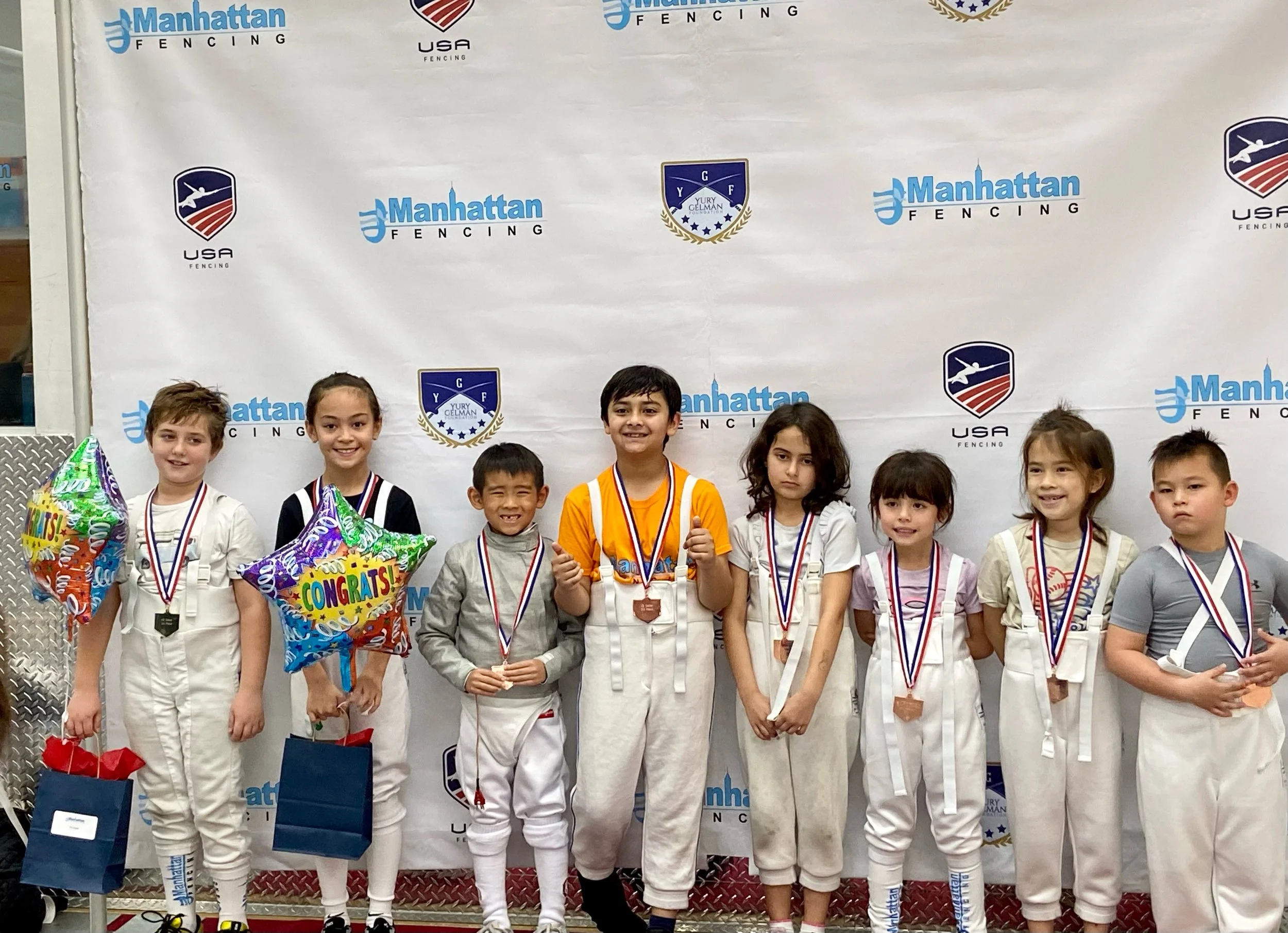 Jordanna Daniels (2L) with a Silver Medal at the Manhattan Fencing Center Liberty Cup