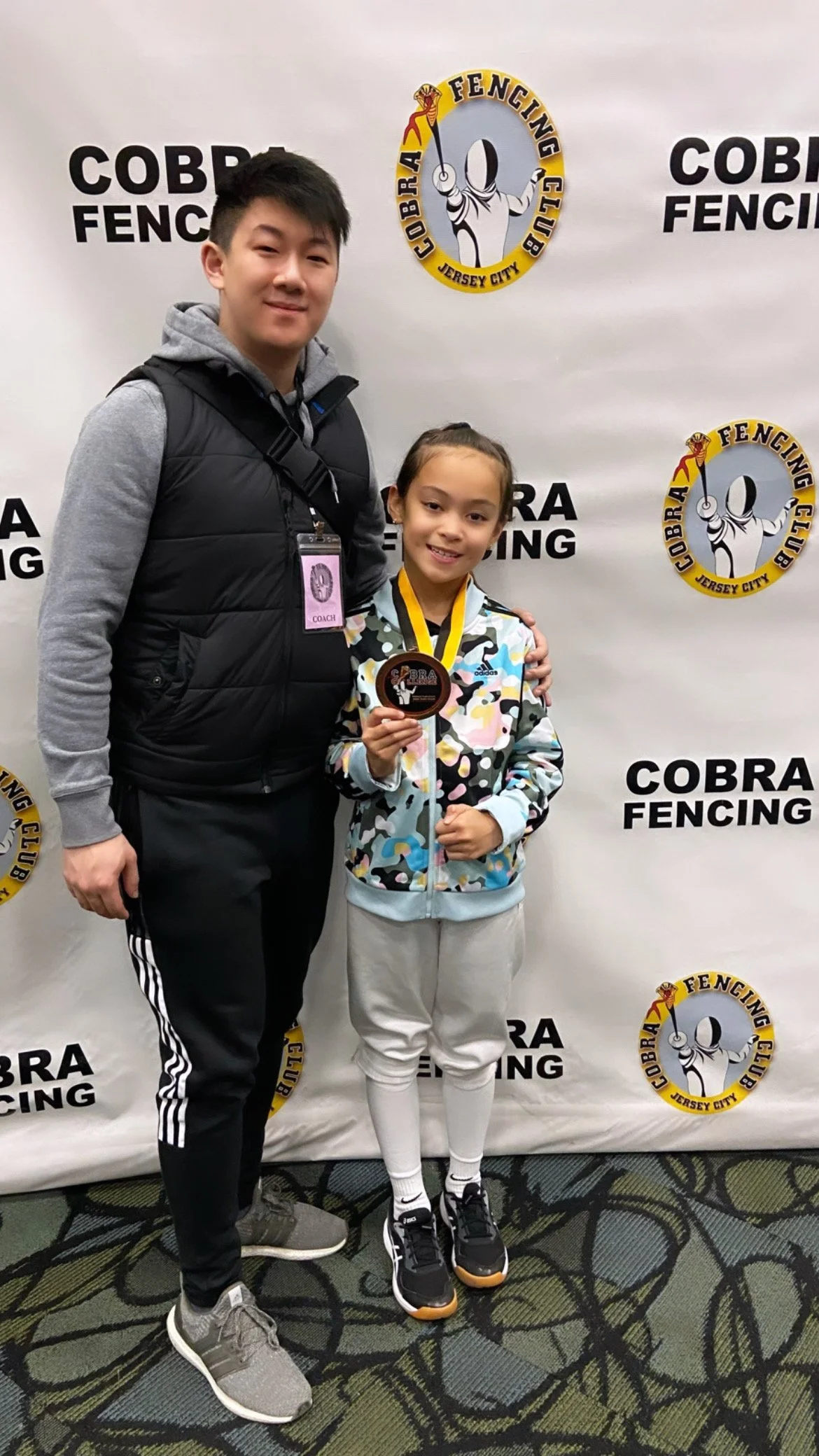 Jordanna Daniels with her first regional 8th Place medal in Y8 Mixed Saber at the Cobra Challenge RYC