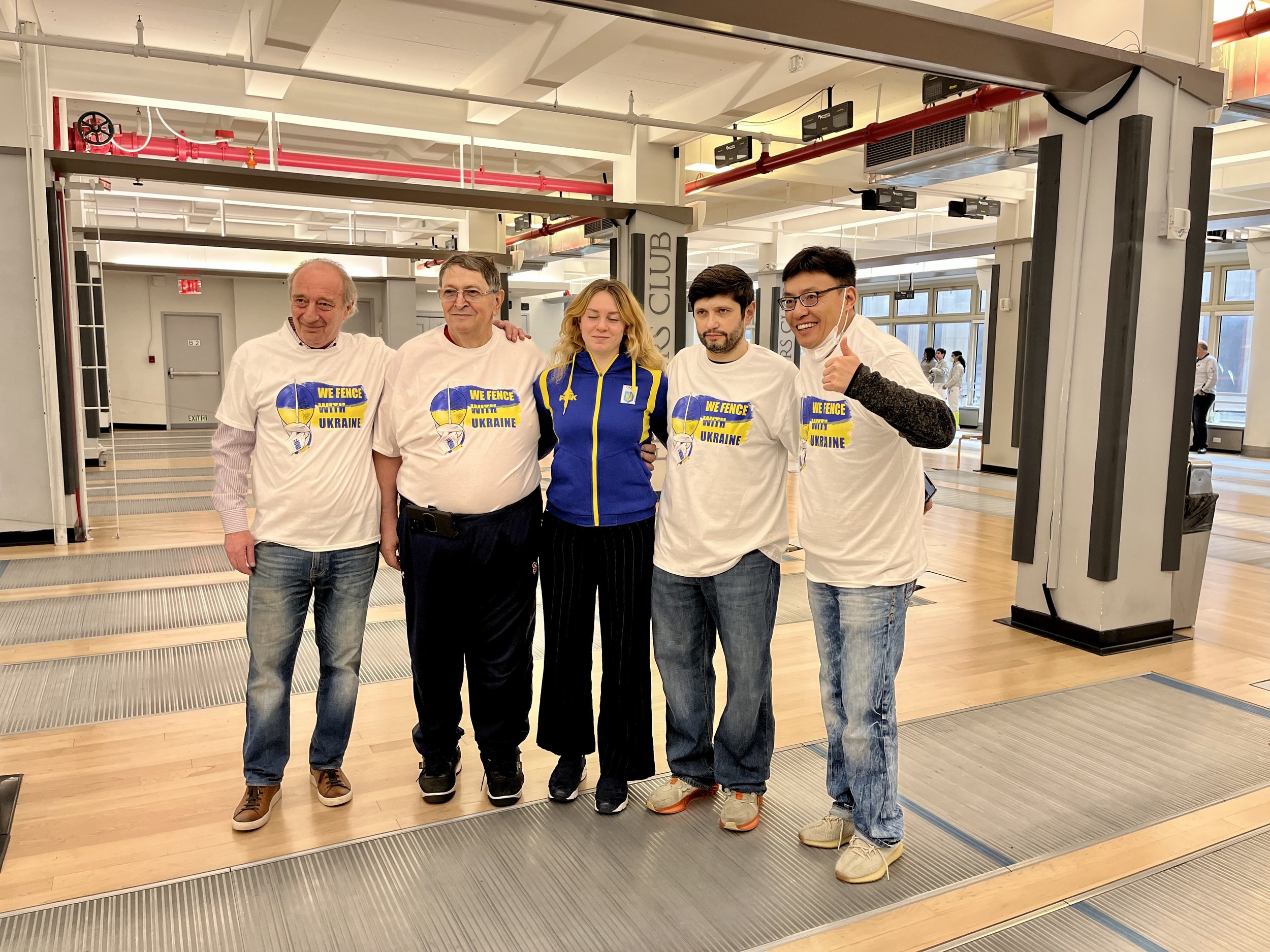 Coach Igor, Coach Misha, and Allegro parent David Wang with good friends and coaches from Dynamo Fencing Center
