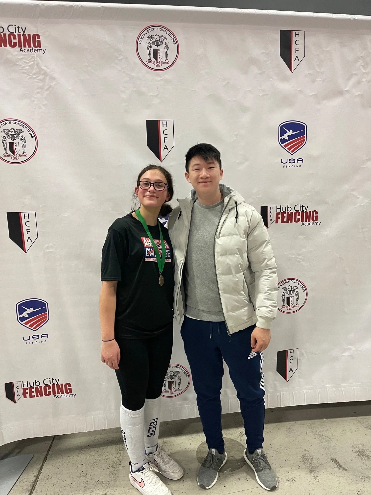 Sophia Gomerman with Coach Brian after her Bronze Medal finish at the Garden State RYC