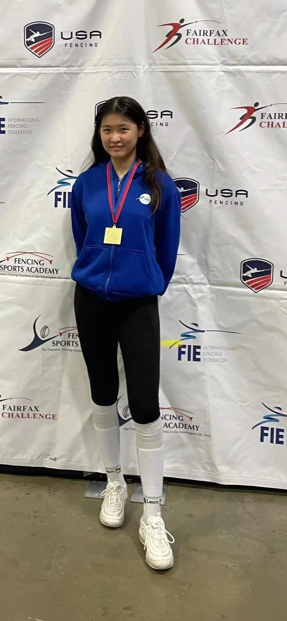 Lefu Chen with her Gold Medal in Junior Women's Epee at the Fairfax RJC