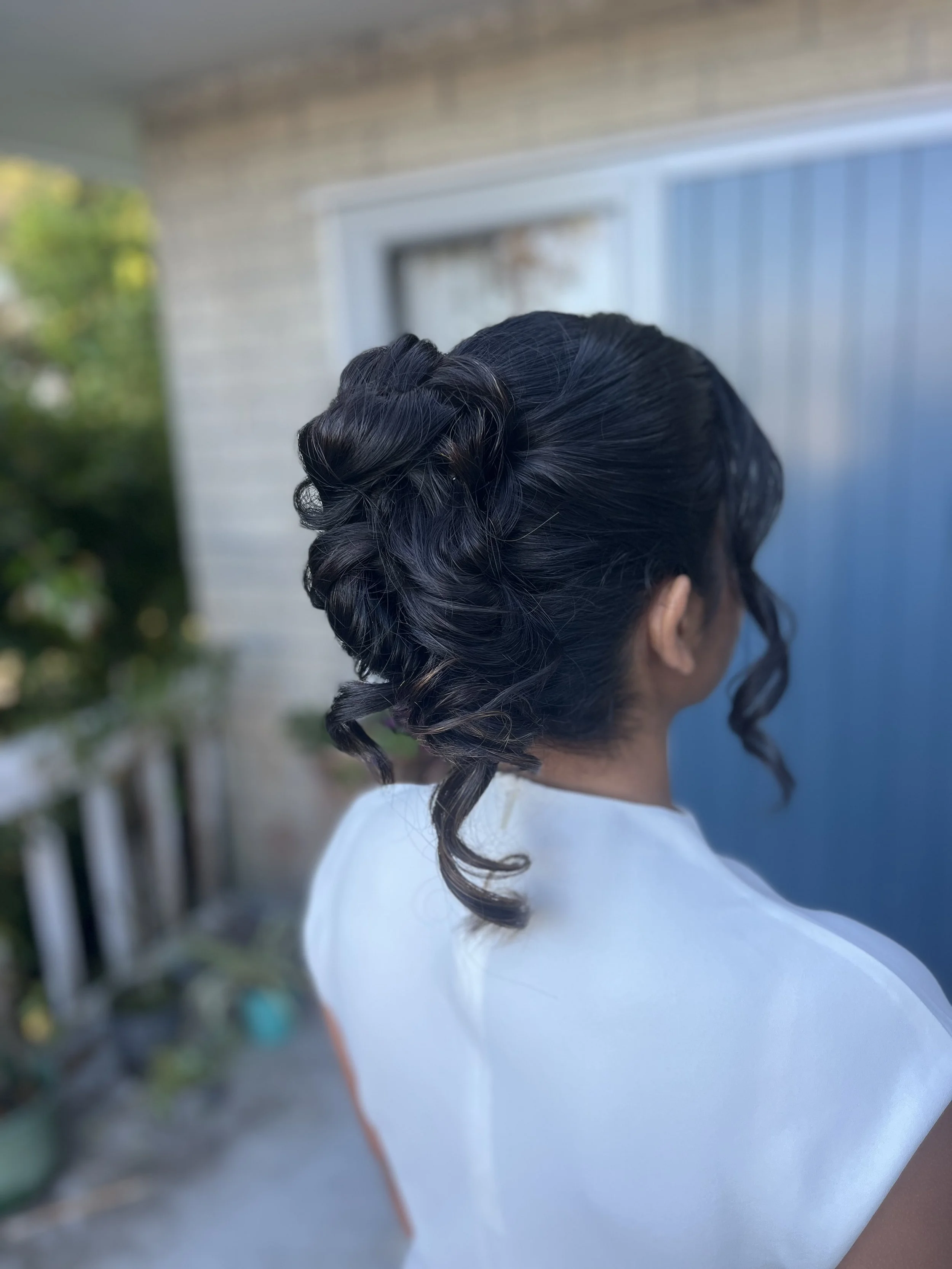 messy french twist bridal hairstyle for catholic bride ready for her intimate elopement style church wedding ceremony.