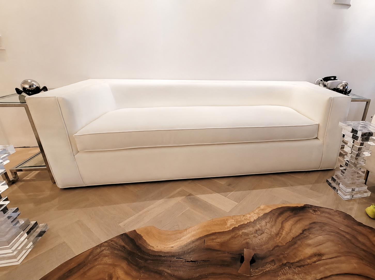 Large white sofa professionally disassembled and reassembled inside a home
