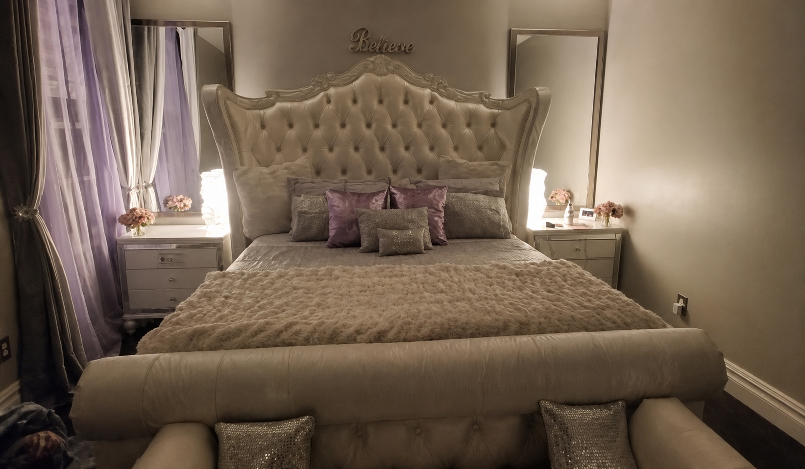 Oversized tufted upholstered bed frame and headboard professionally disassembled and reassembled inside a bedroom
