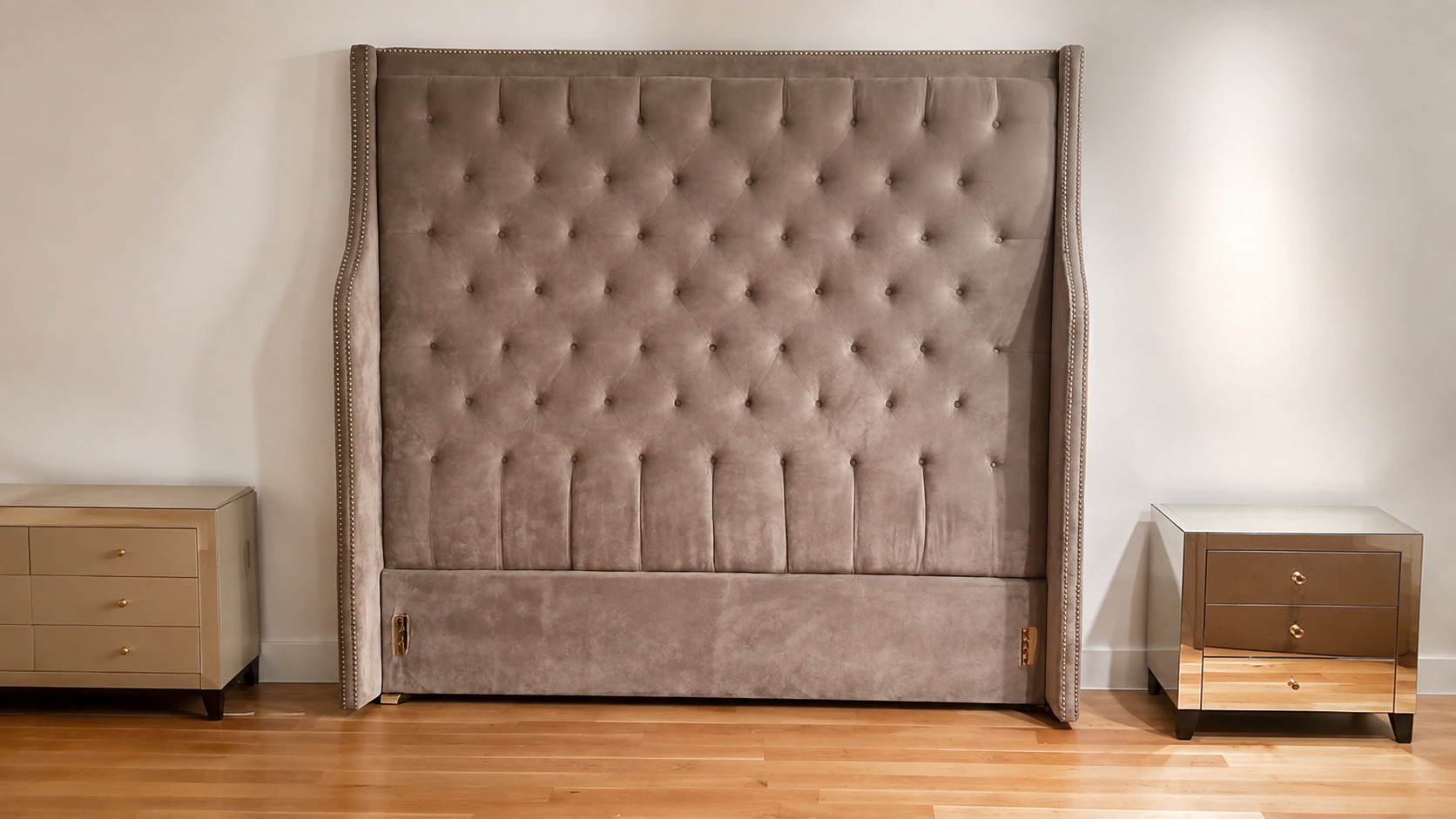 Oversized taupe velvet tufted headboard professionally reassembled with winged sides and nailhead trim