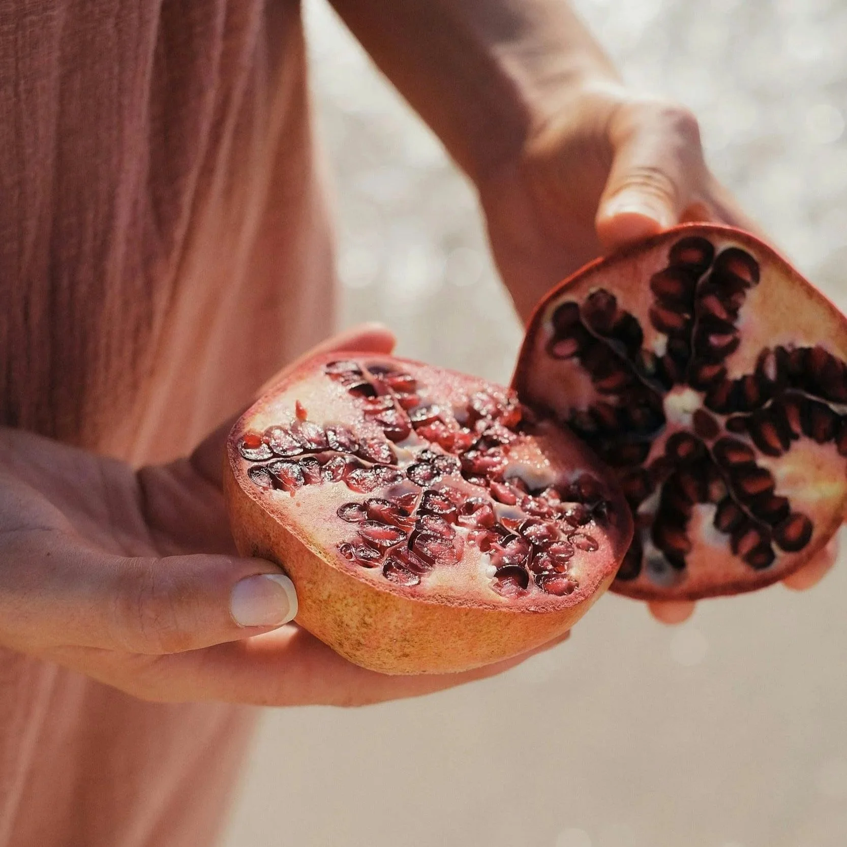 Woman holding a pomegranate