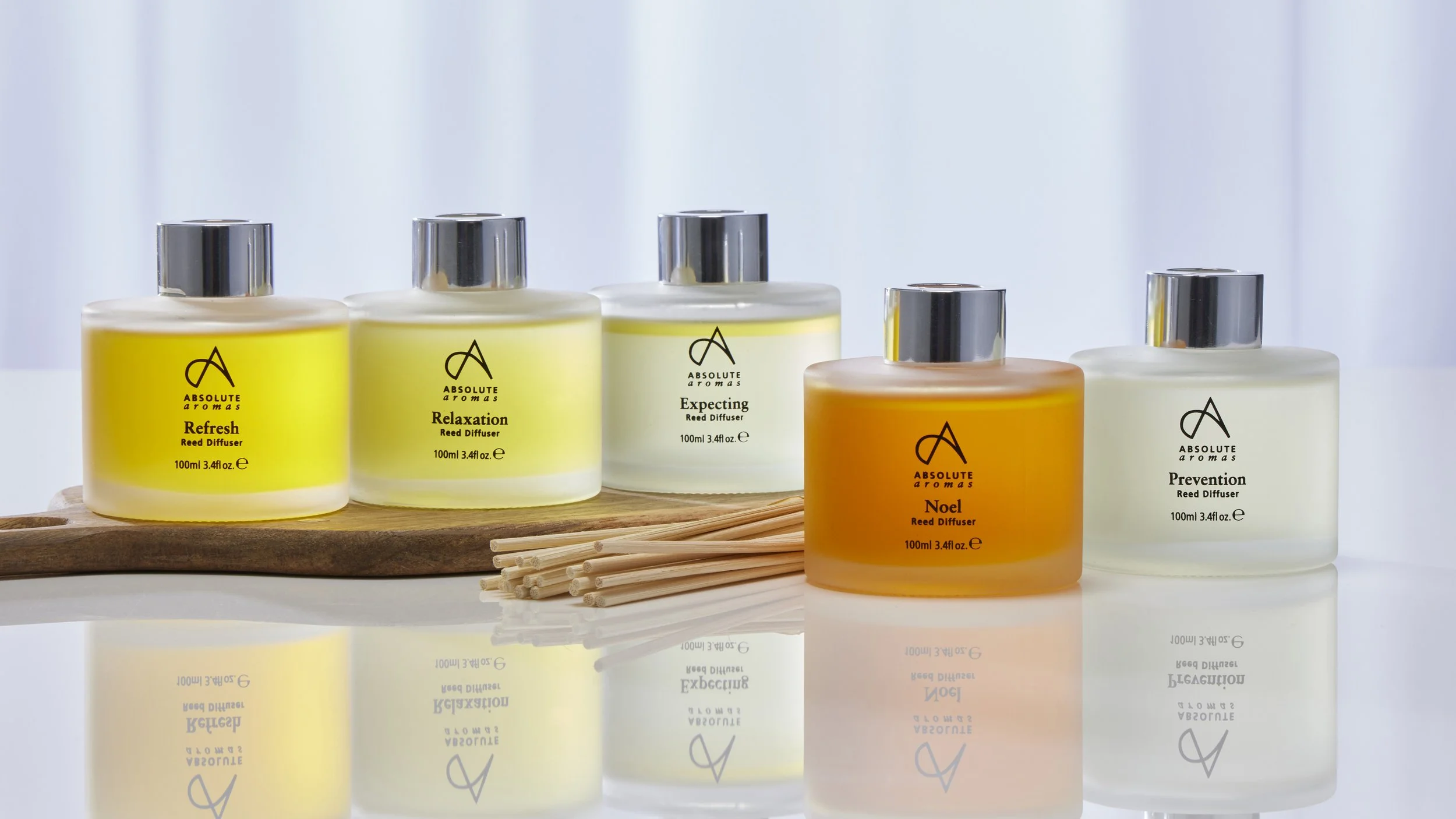 Range of colourful aromatherapy oils arranged in a spa setting