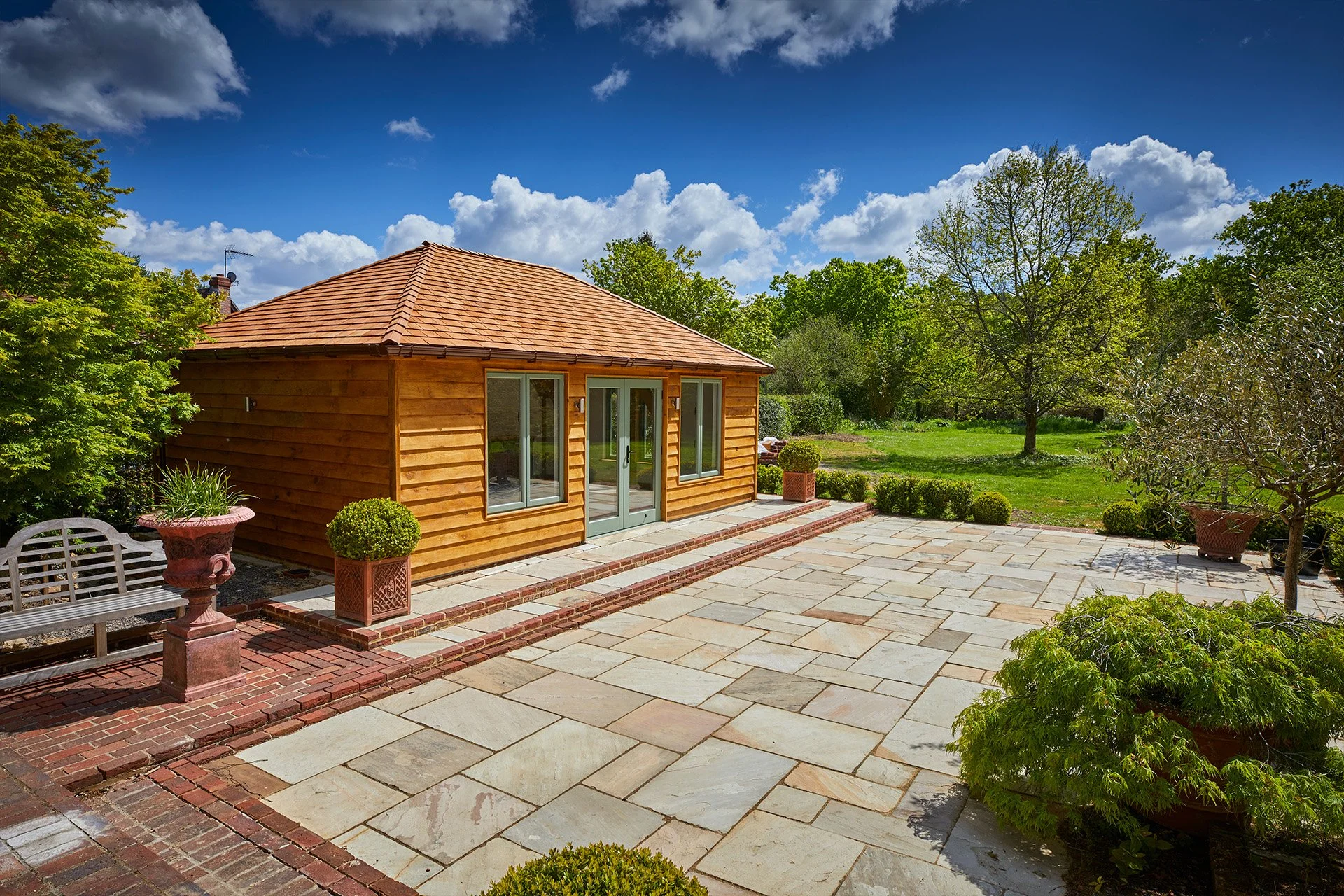 Architectural photography of wooden garden building with a patio