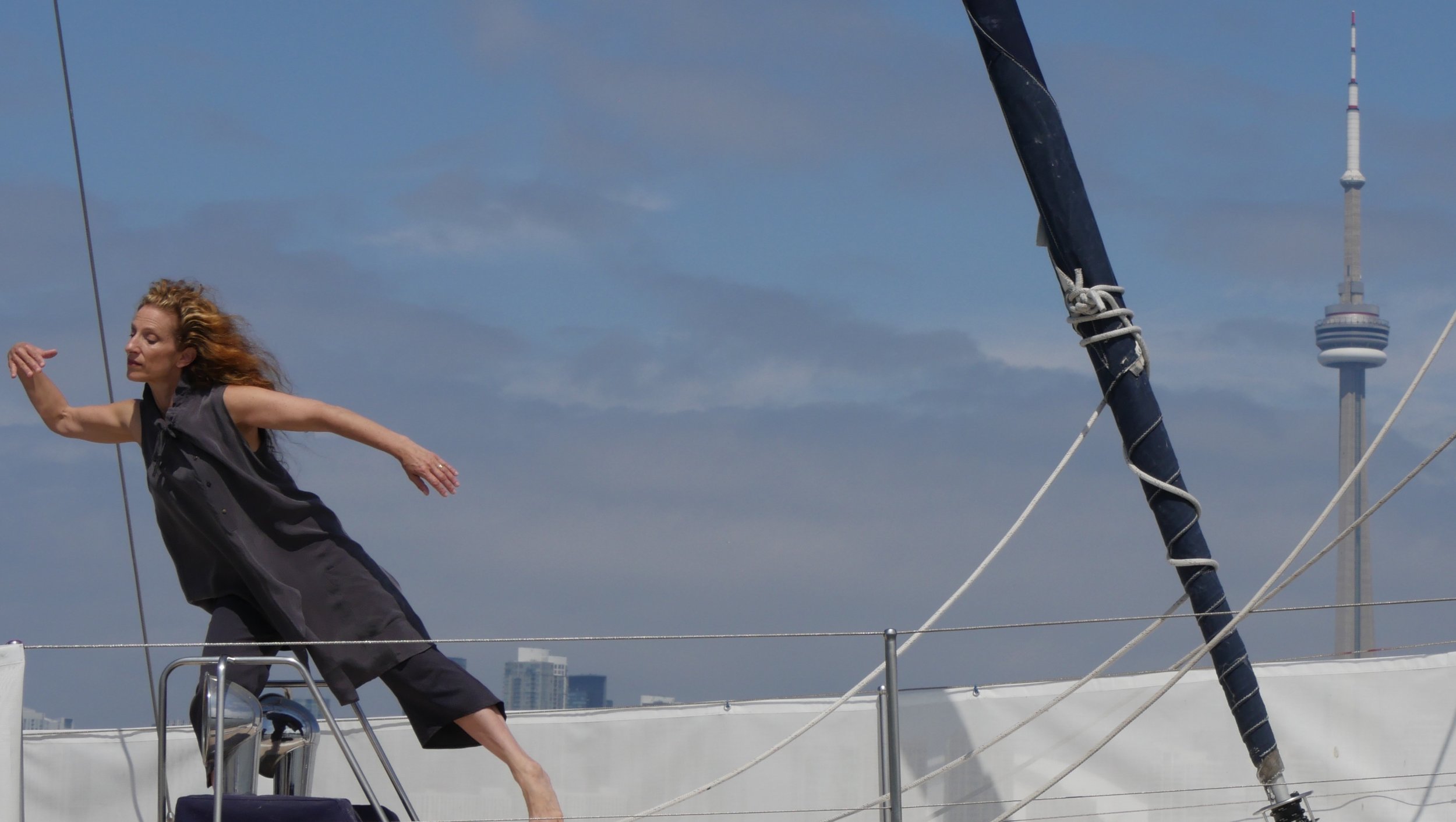 Karen Kaeja dances on a boat.