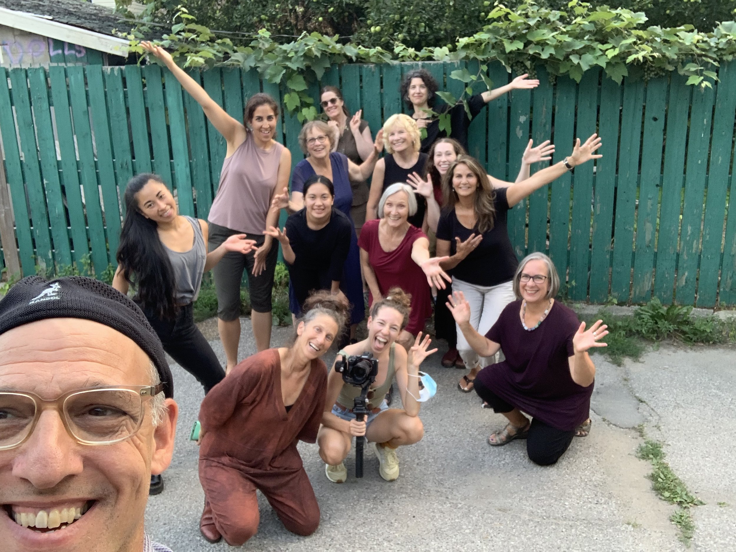 Casual group photo of community participants and some dancers.