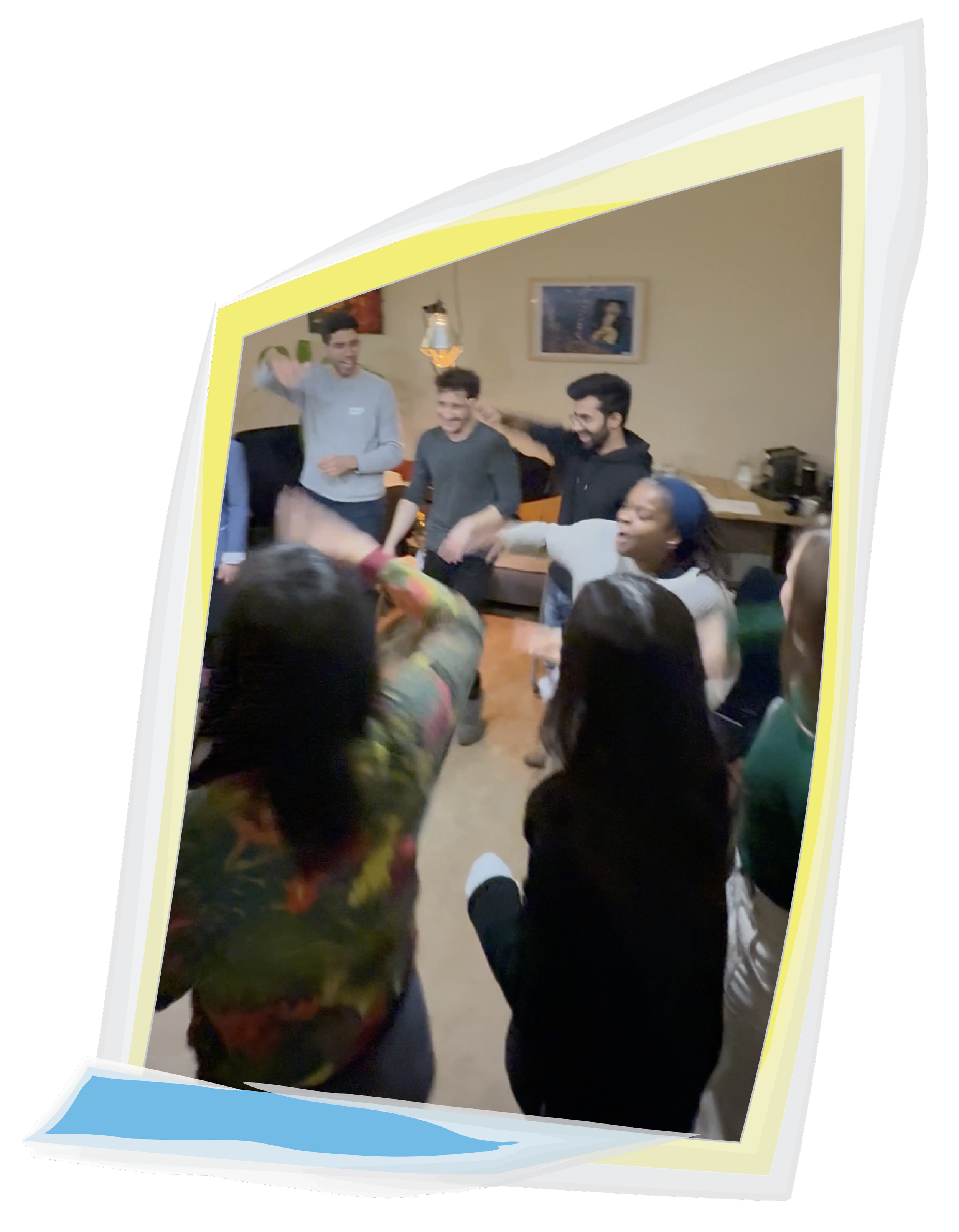 Veronica Louis as part of a circle of people laughing and waving their right arms about