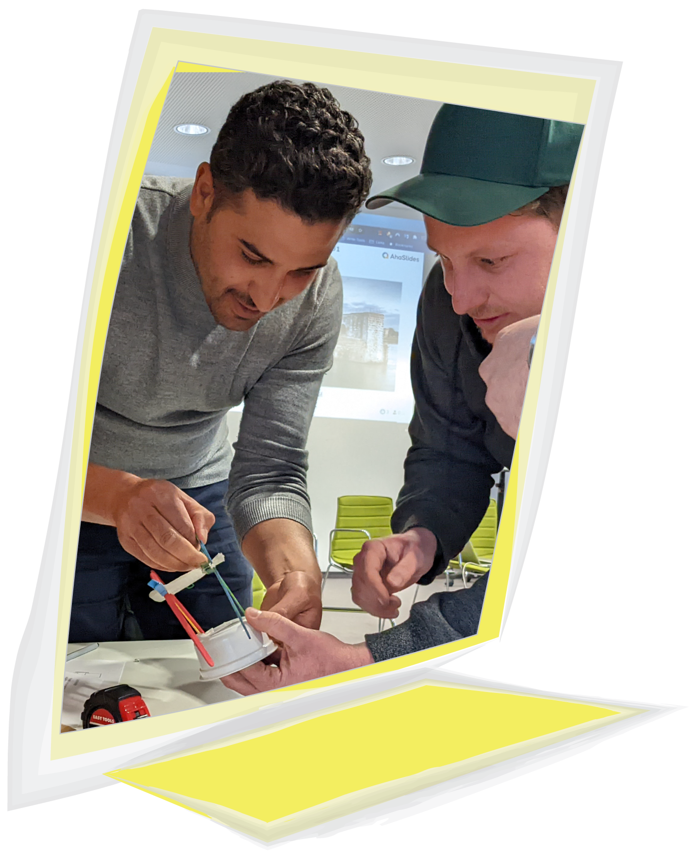 From a Veronica Louis Workshop: Photo of two men working on a creative craft project together.
