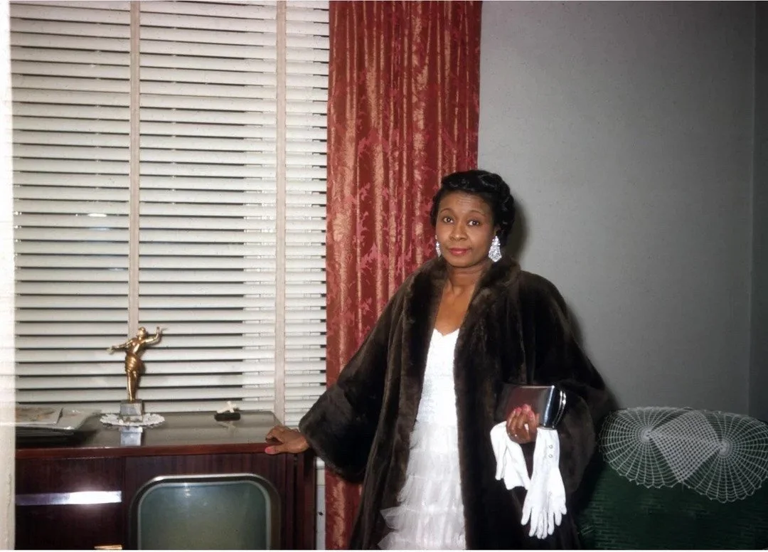 Kodachrome shot of a very stylish lady ready to go out, 1955.