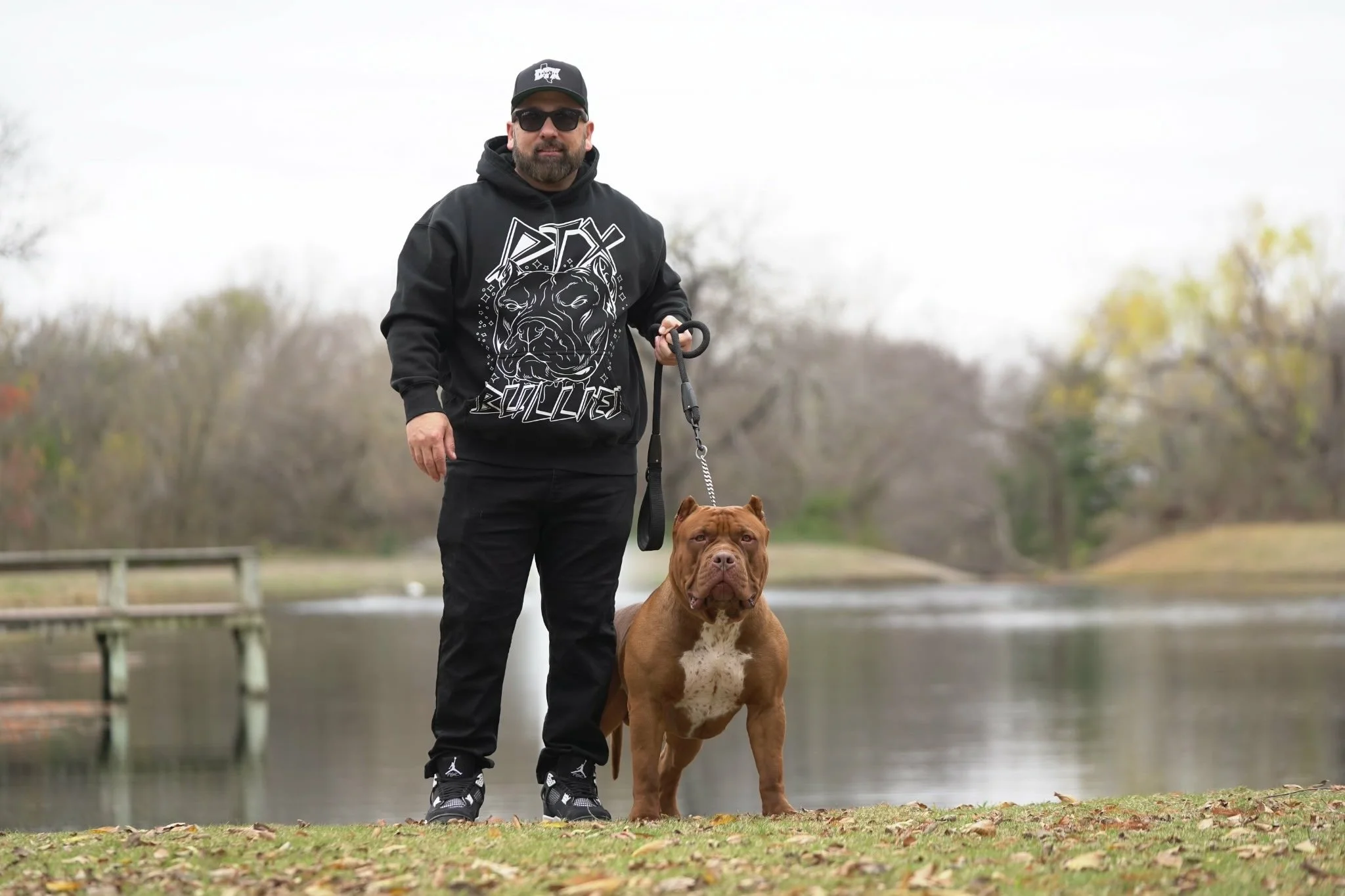 DTX Bullies owner with Ch. Apex, ABKC Champion XL American Bully stud in Dallas Texas