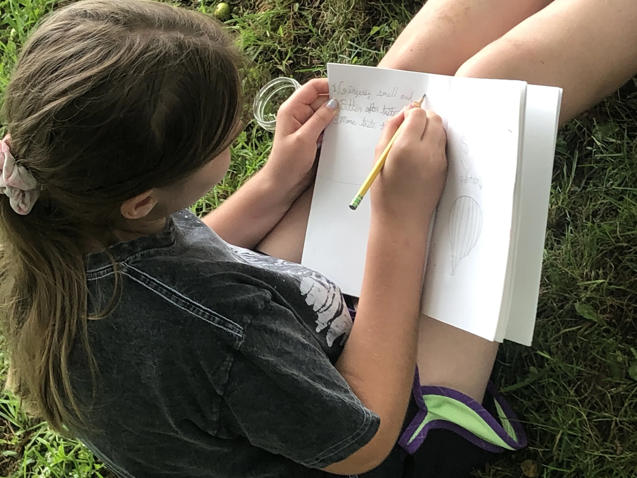 Isabelle writing in journal.jpg