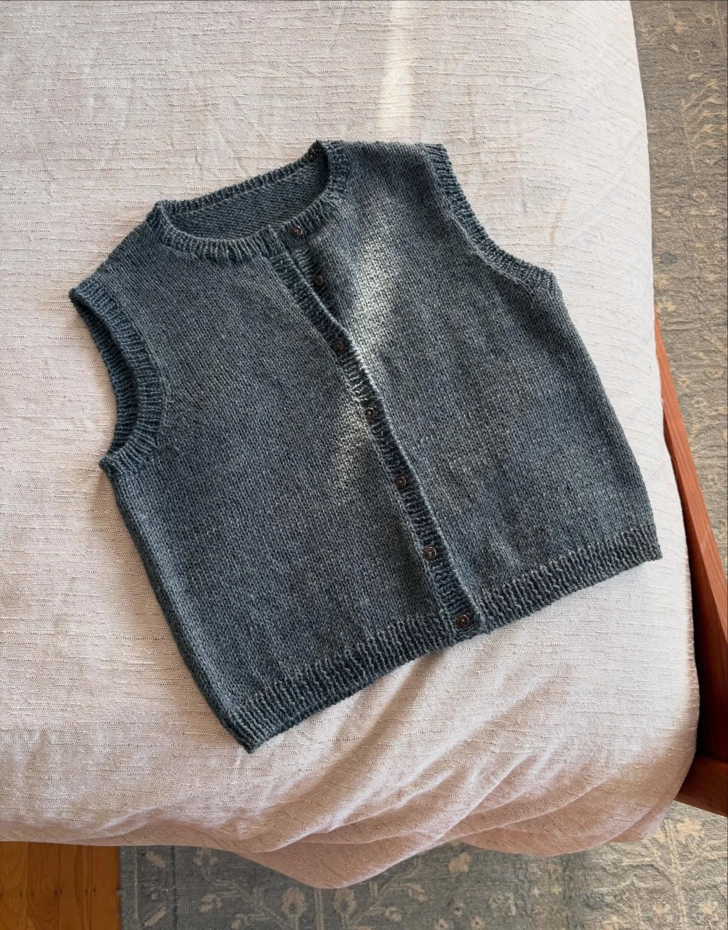 That new finished object feeling. 🥹 This #sallyvest turned out just as I hoped, and like so many knits, it&rsquo;s full of memories: I bought the yarn at @yarnoclock2 after a deliciously gloomy bus ride through Wales while staying, for a few days, a