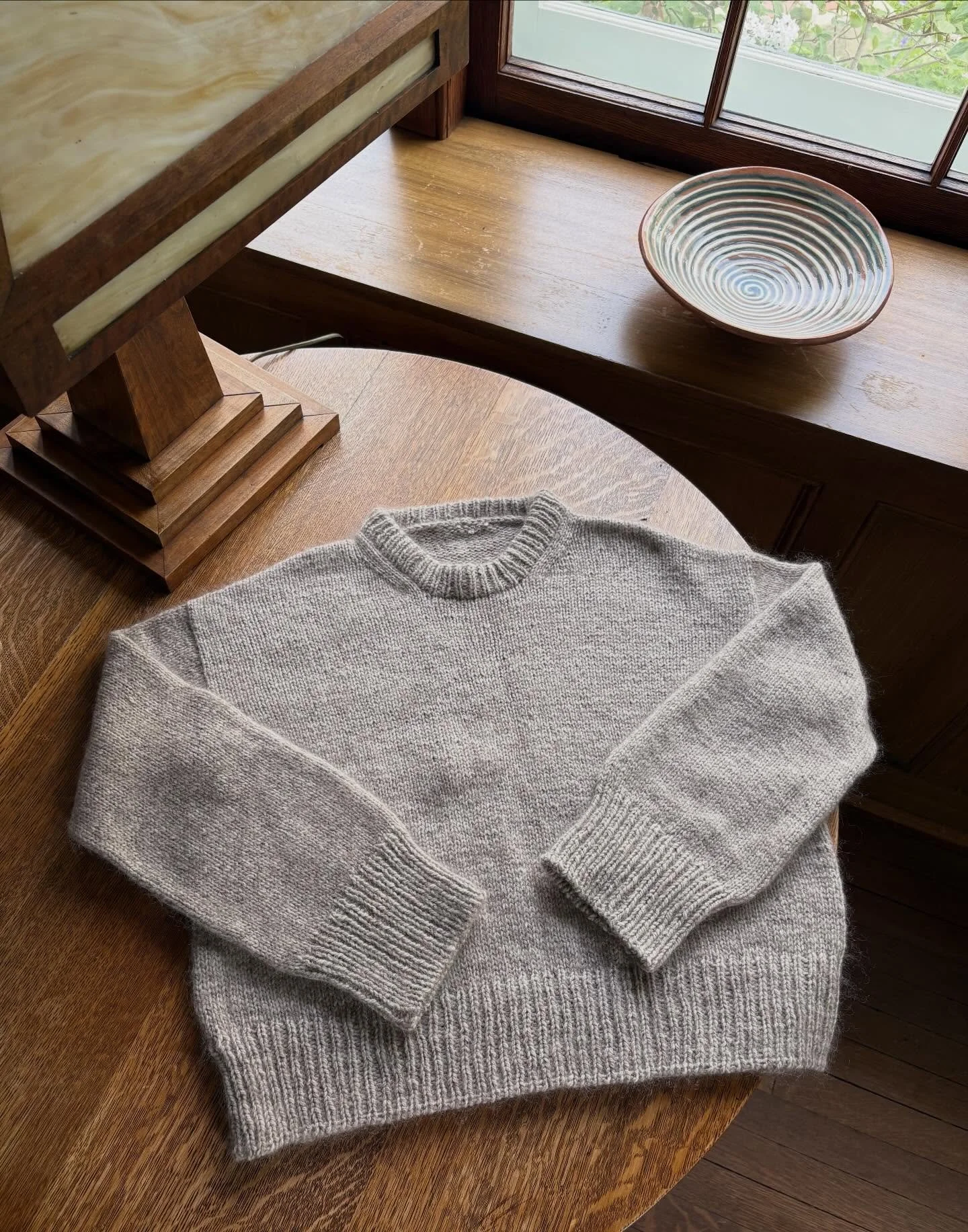 She&rsquo;s done! My #sweaterno23 came to London, Amsterdam, and Wales with me earlier this year, the color a reflection of their moody February skies. 
.
I loved this pattern and can definitely see myself making another; the details are beautiful, l