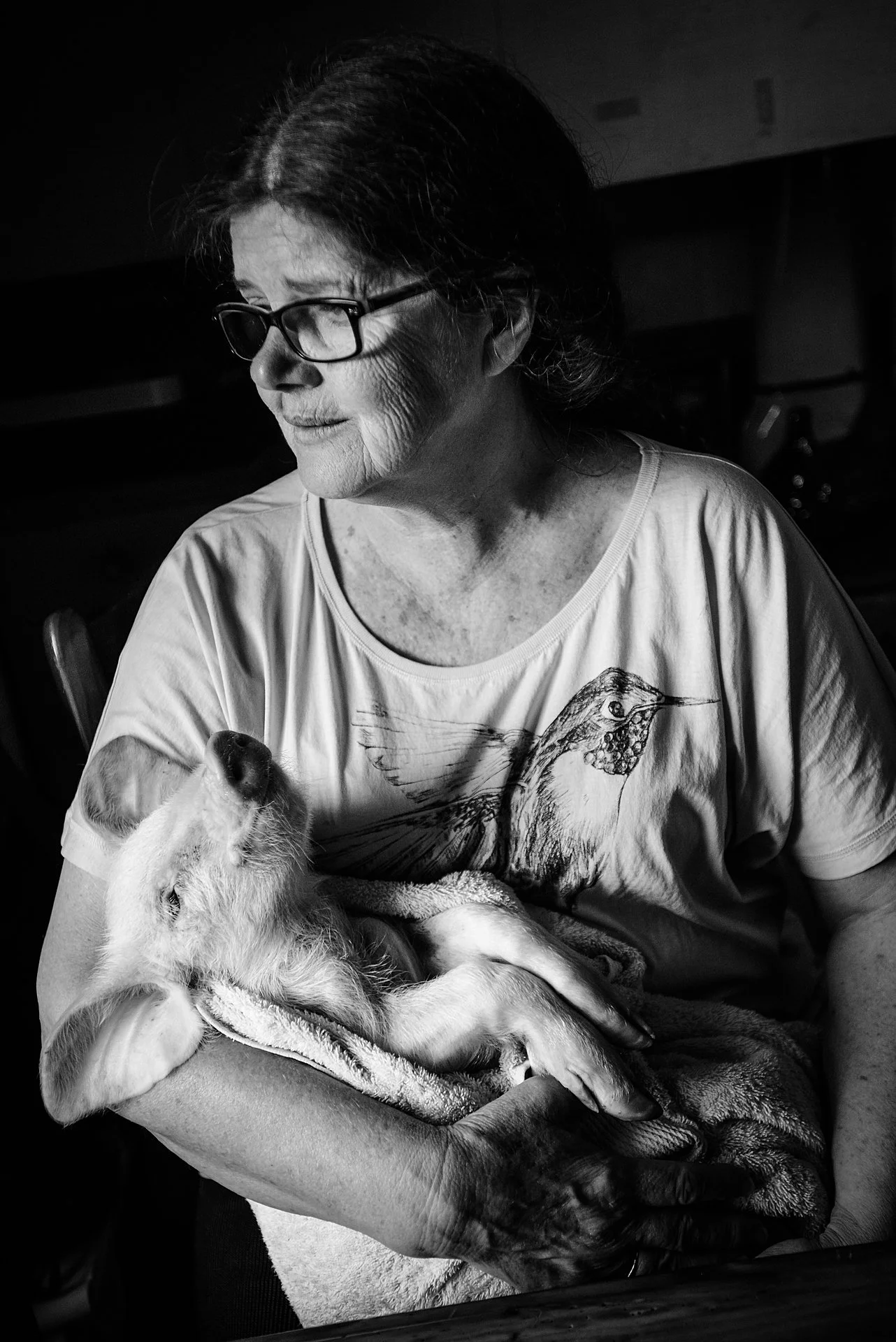 Mourning the death of a piglet who was taken from a farm during an open rescue. Liberation Sanctuary, Australia, 2013. Jo-Anne McArthur / Animal Liberation Victoria / We Animals