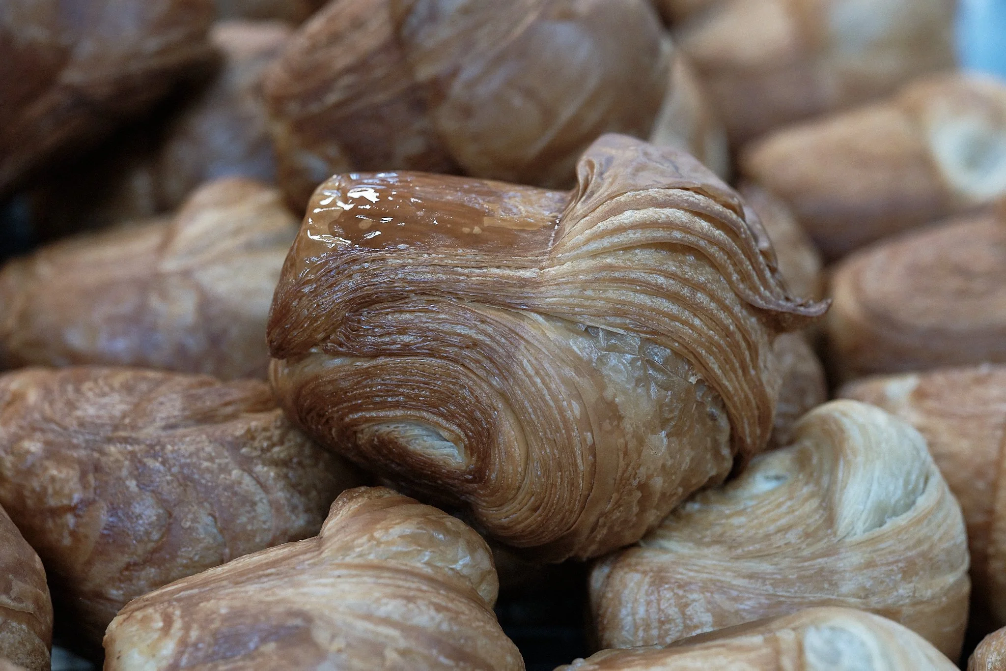Detail of freshly baked house vegan puff pastry. Gauthier Soho, London, England, UK, 2024. Nathalie Merle / We Animals