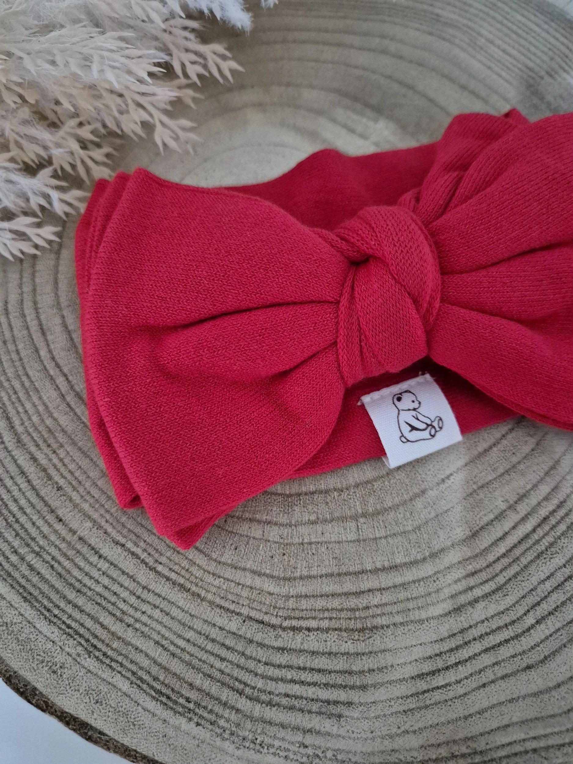 Complete the festive look with our adorable red knit double bow headband - the sweetest accessory for Christmas photos and celebrations.