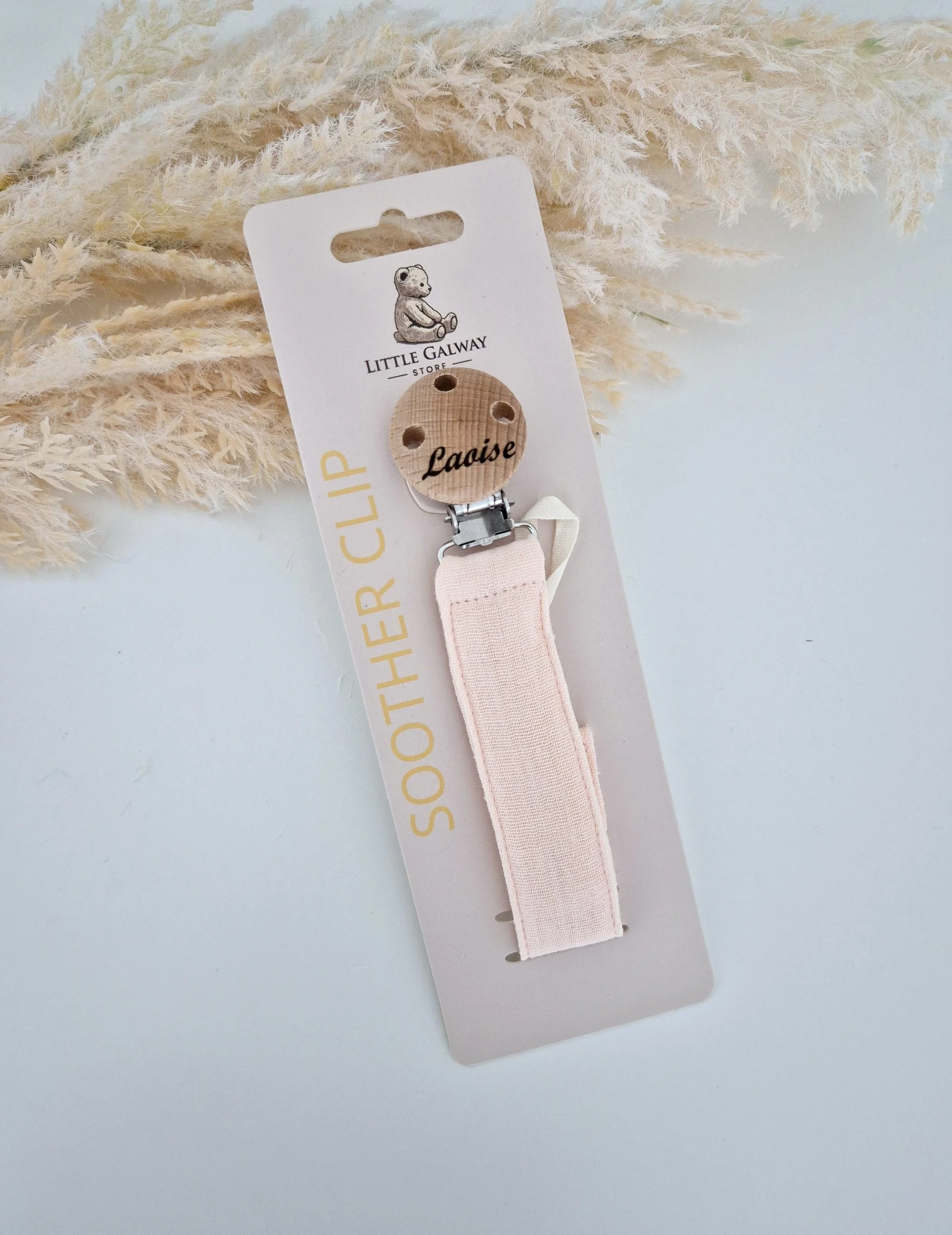 natural linen soother clip collection features a peachy pink linen soother clip and a Natural flax linen soother clip.