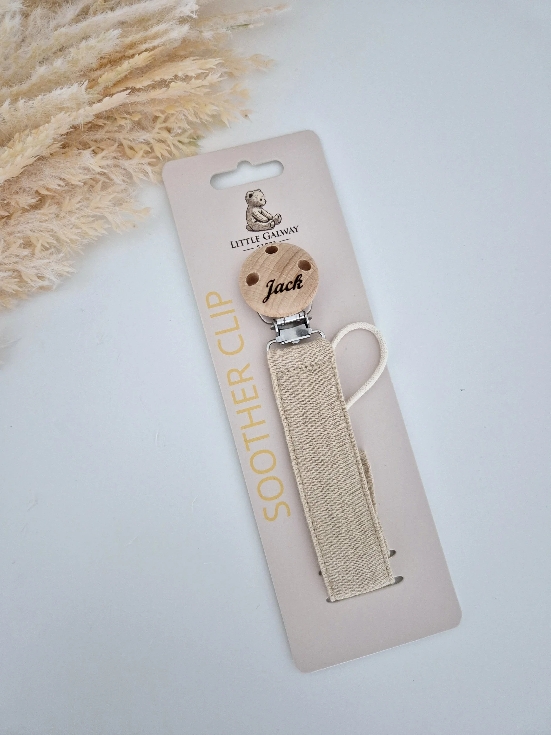 natural linen soother clip collection features a peachy pink linen soother clip and a Natural flax linen soother clip.