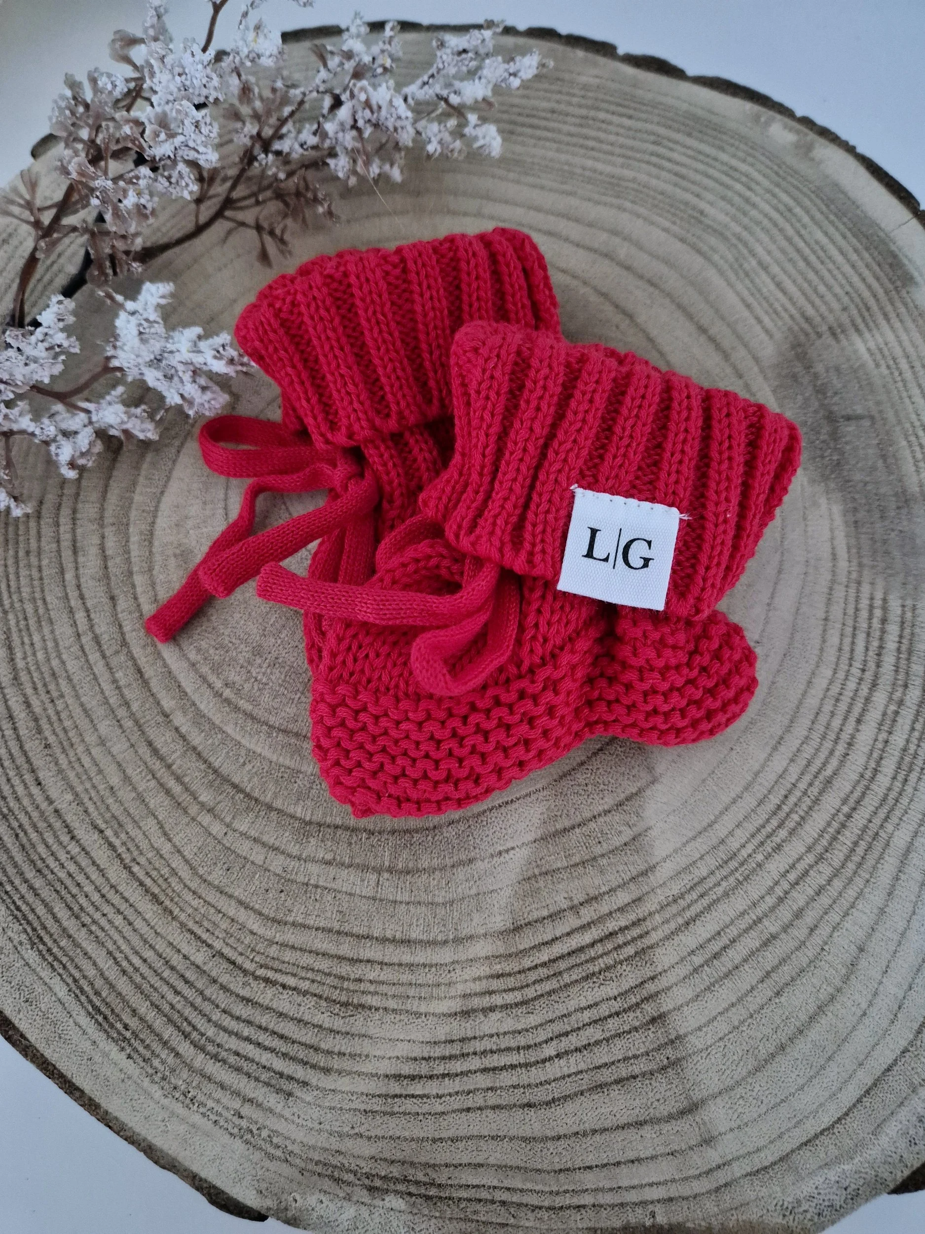Keep those tiny toes snug and festive with our cosy christmas red knit booties
