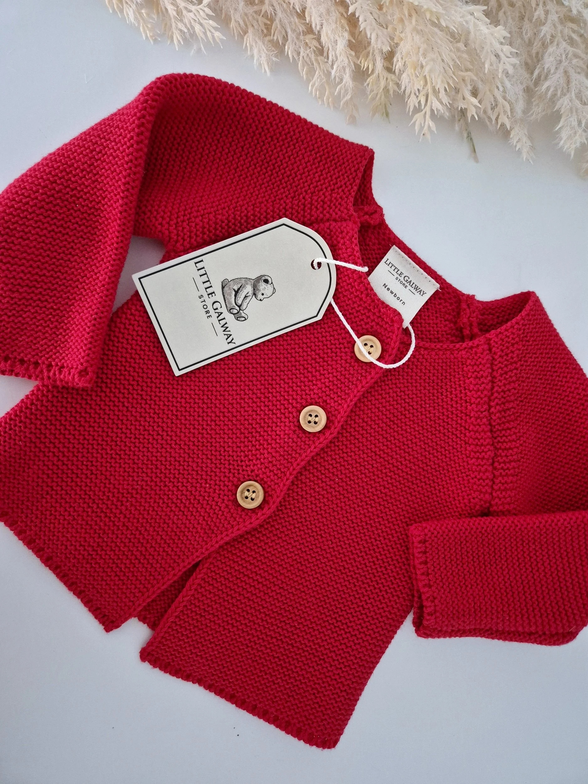 Introducing our gorgeous Christmas Red knit cardigan. A beautiful shade of red, perfect for the festive season and beyond! Beautifully soft, cosy knit, this timeless little cardigan is the sweetest ad