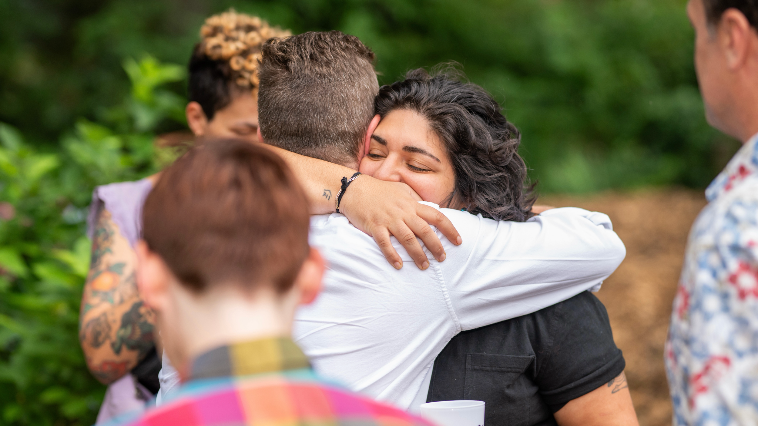 council member Liliana Bahktiari hugging a constituent at an event there are other people in the image out of focus