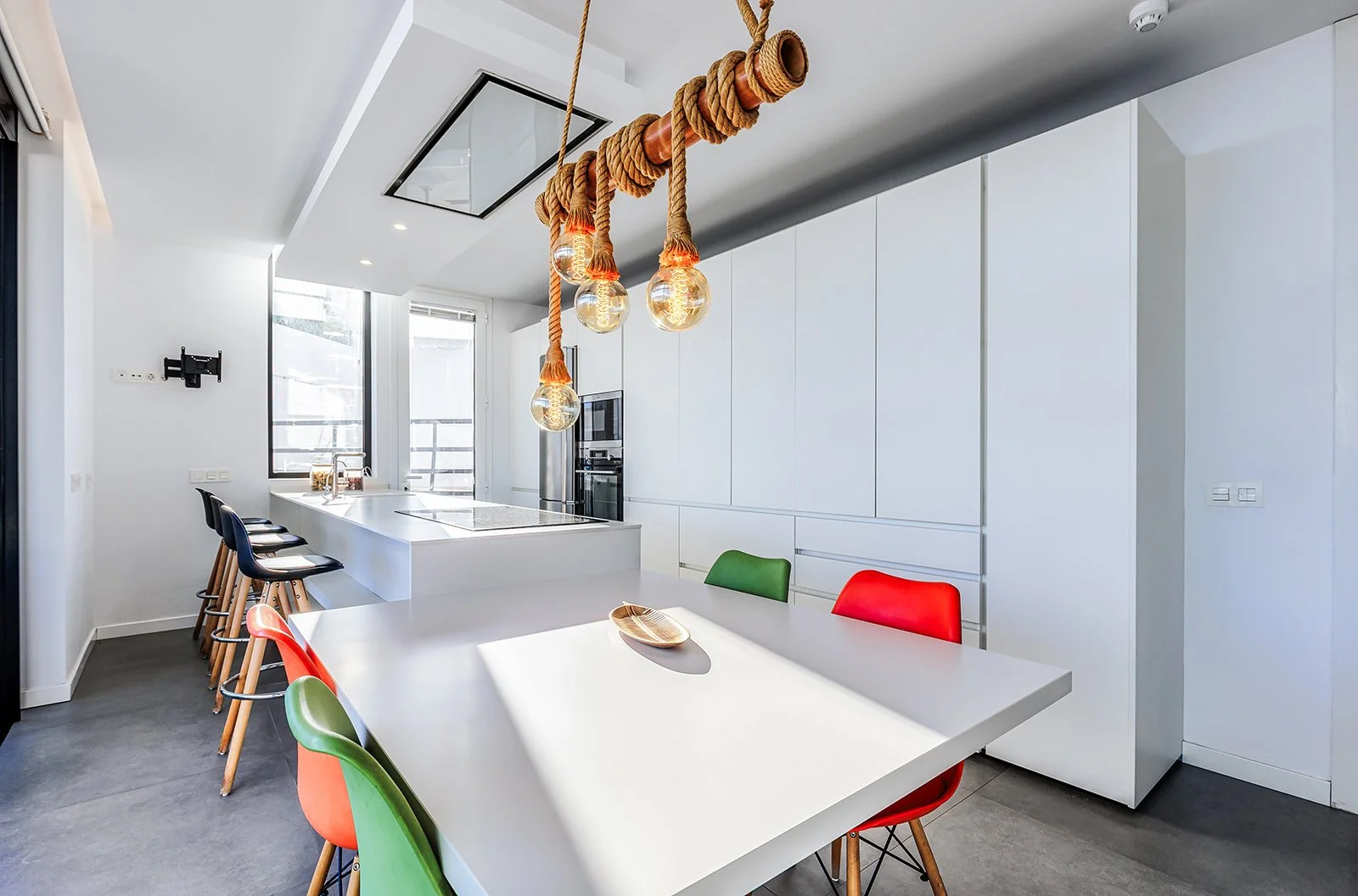 Contemporary white kitchen with natural light in Marbella property