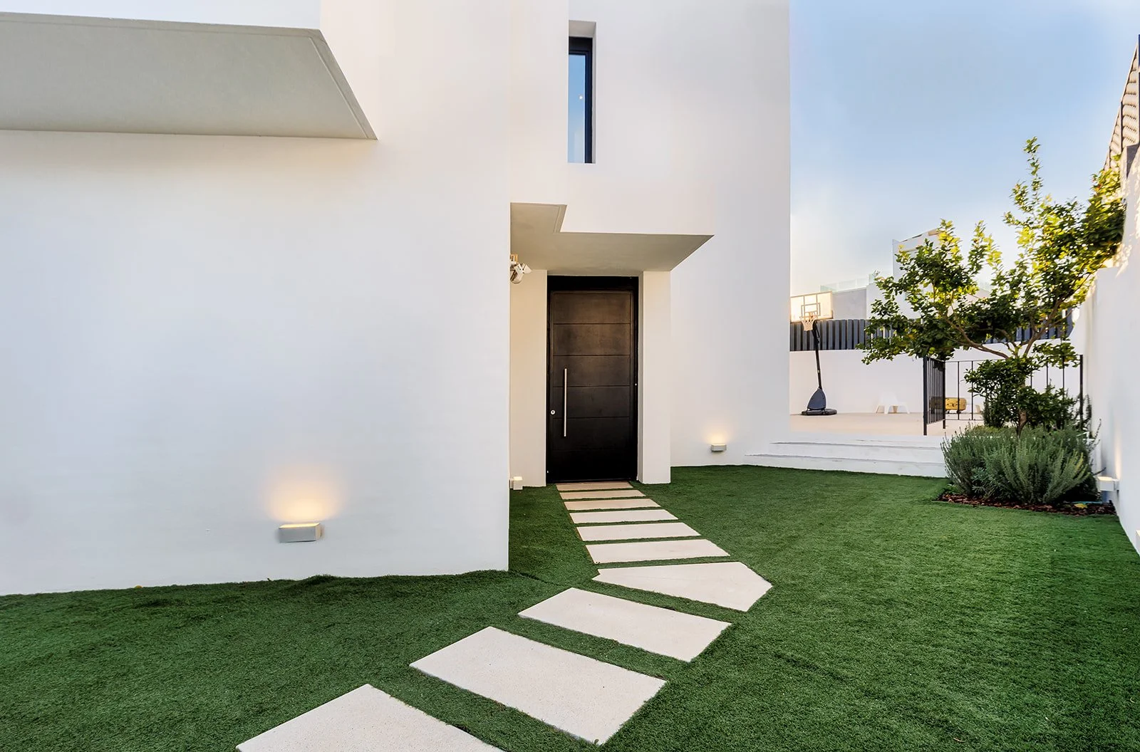 Modern luxury villa in Marbella with minimalist white architecture and contemporary entrance design