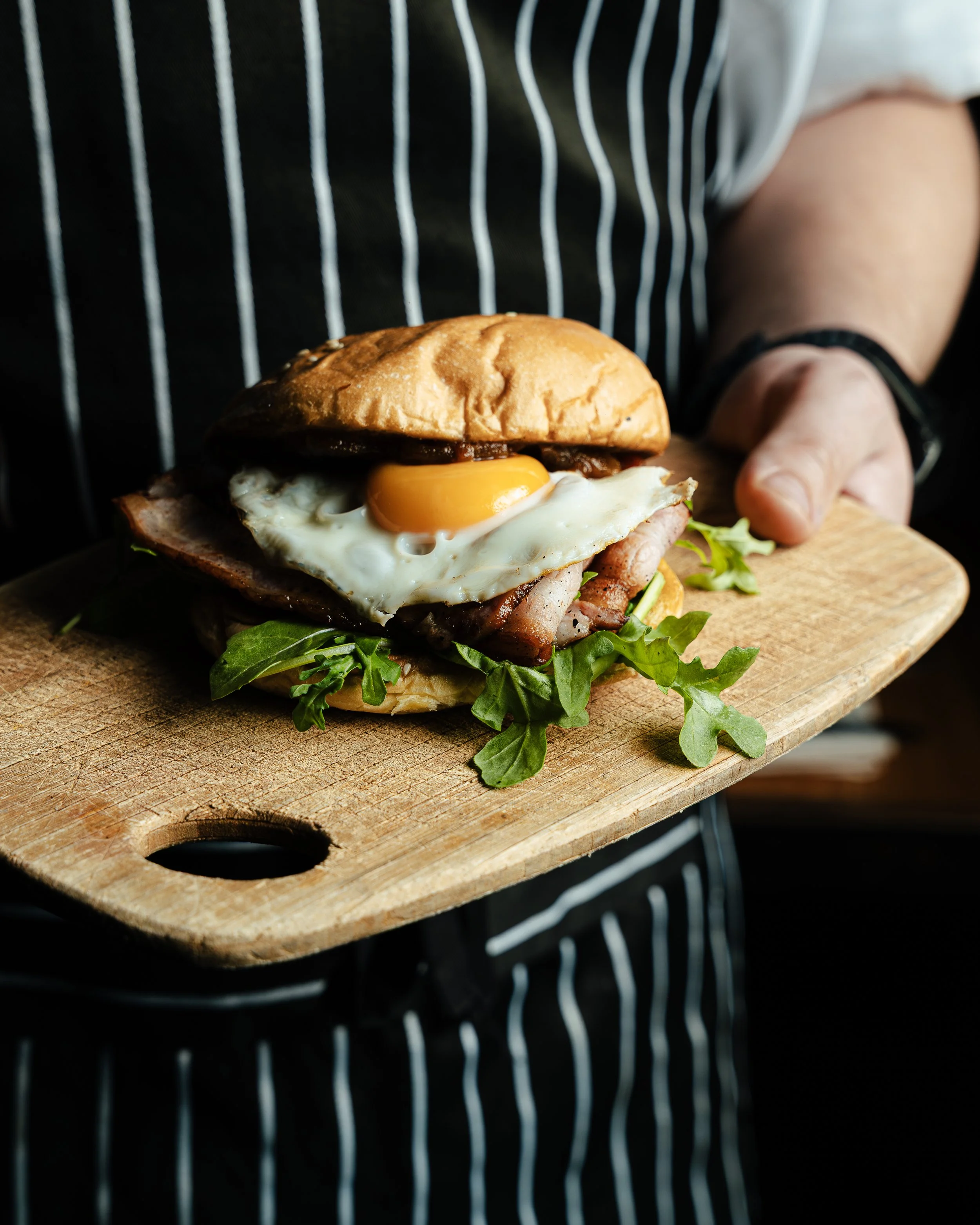 Rockwall Egg & Bacon Roll.  Free range egg from Maydena, Scottsdale Pork tas oak smoked bacon, house made tomato relish on locally baked brioche.