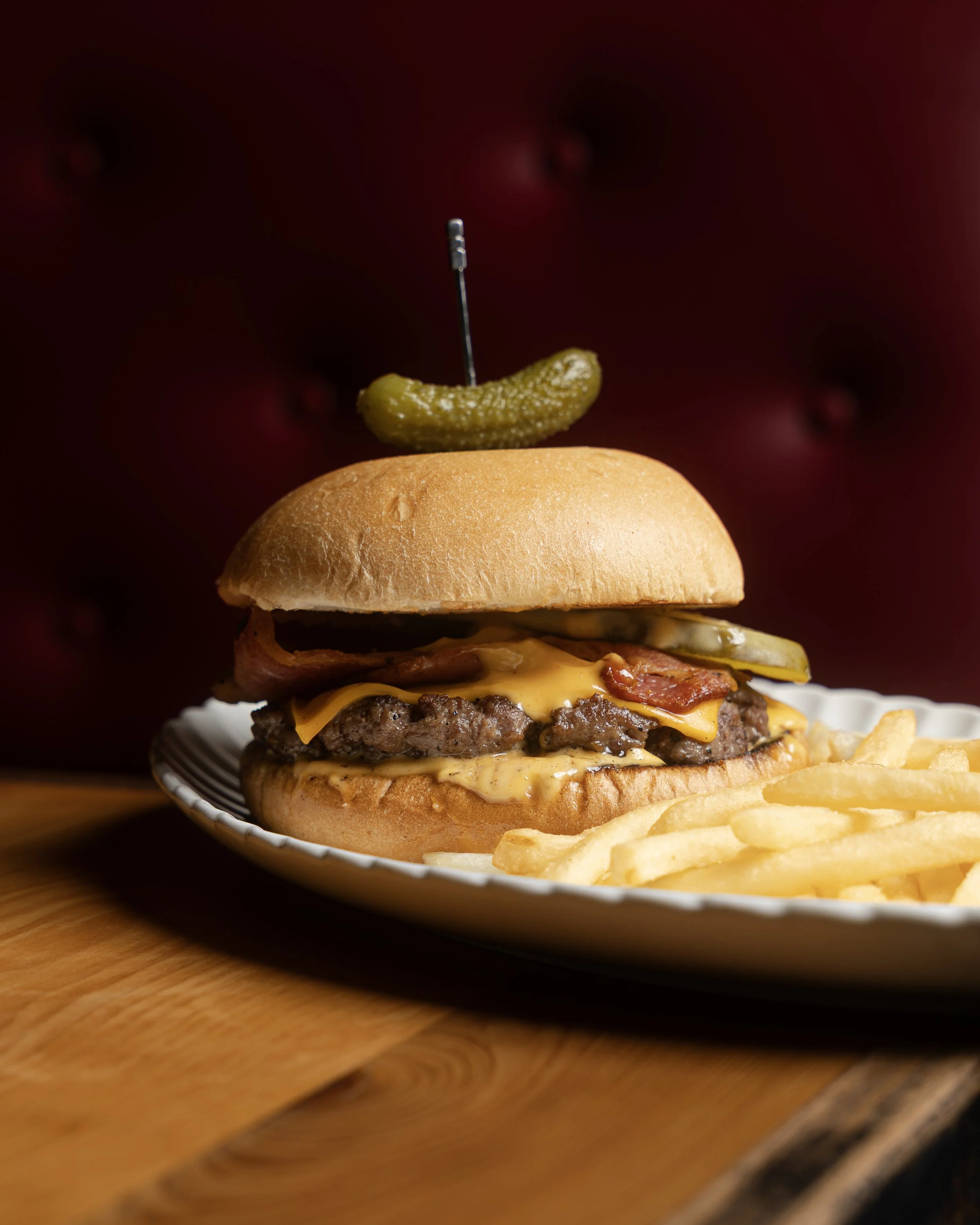 Rockwall's Premium pasture raised Tasmanian beef burger with bacon, cheese, pickles & shoestring fries.